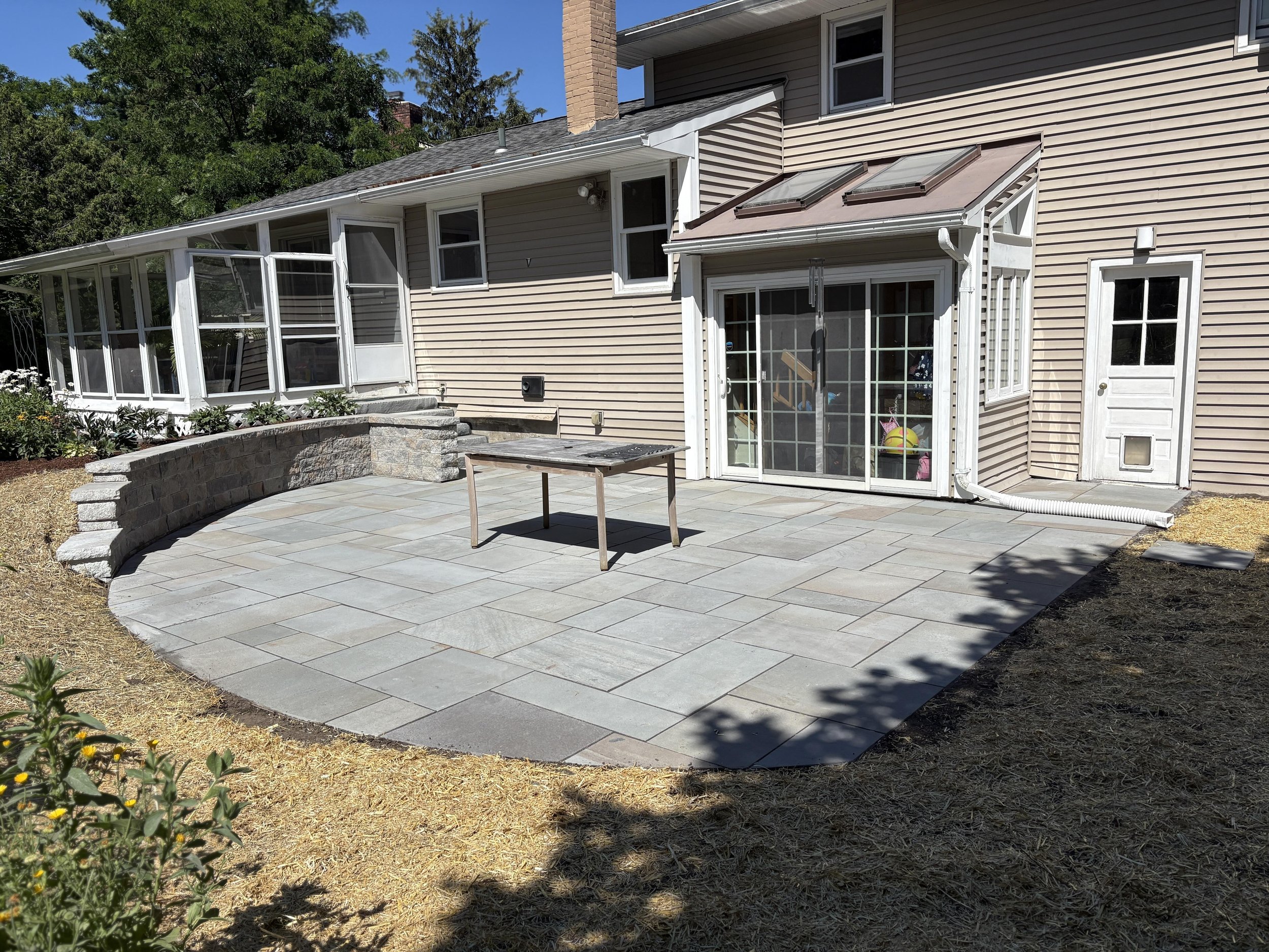 Hardscapes That Add Value: Choosing the Right Patio, Walkway, or Retaining Wall for Your Property