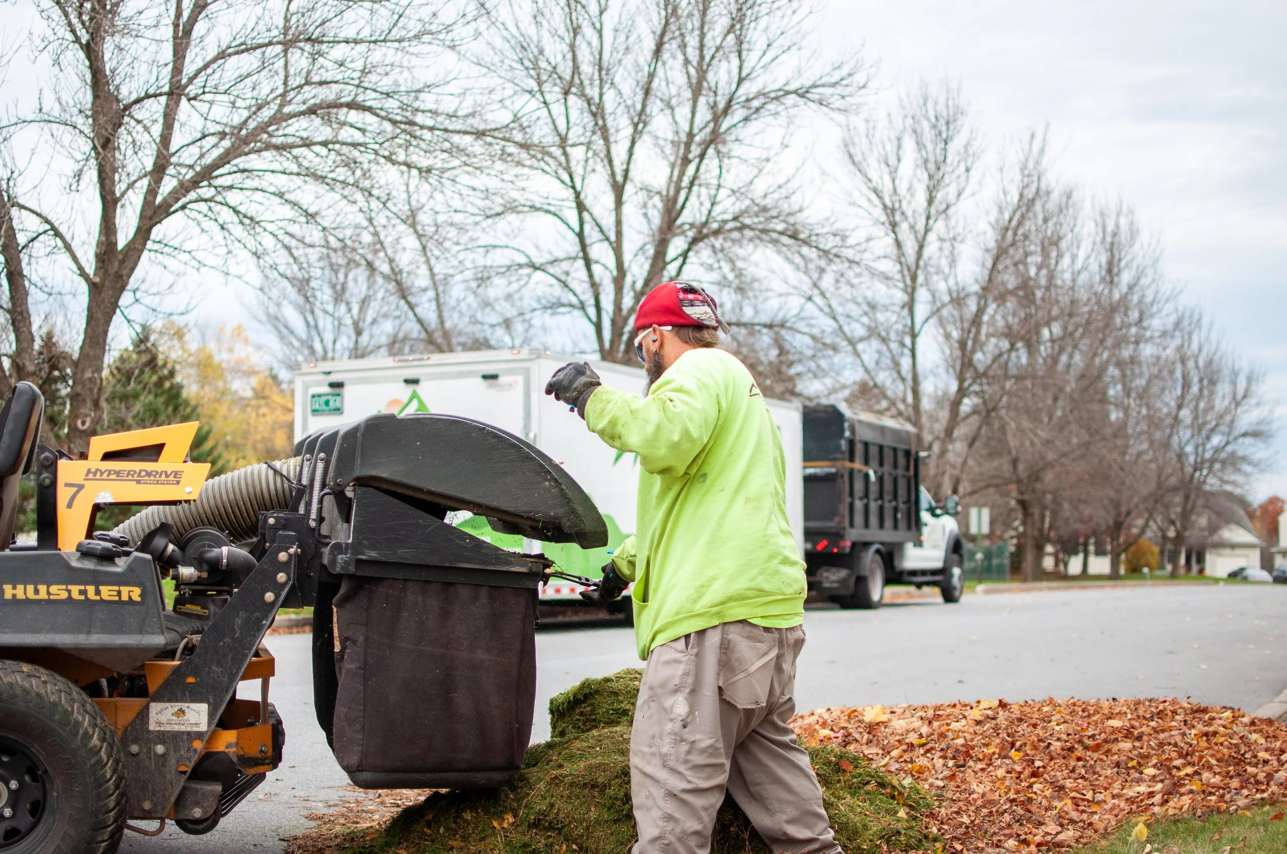 pinnacle properties landscaper clearing leaves and debris in preparation for winter