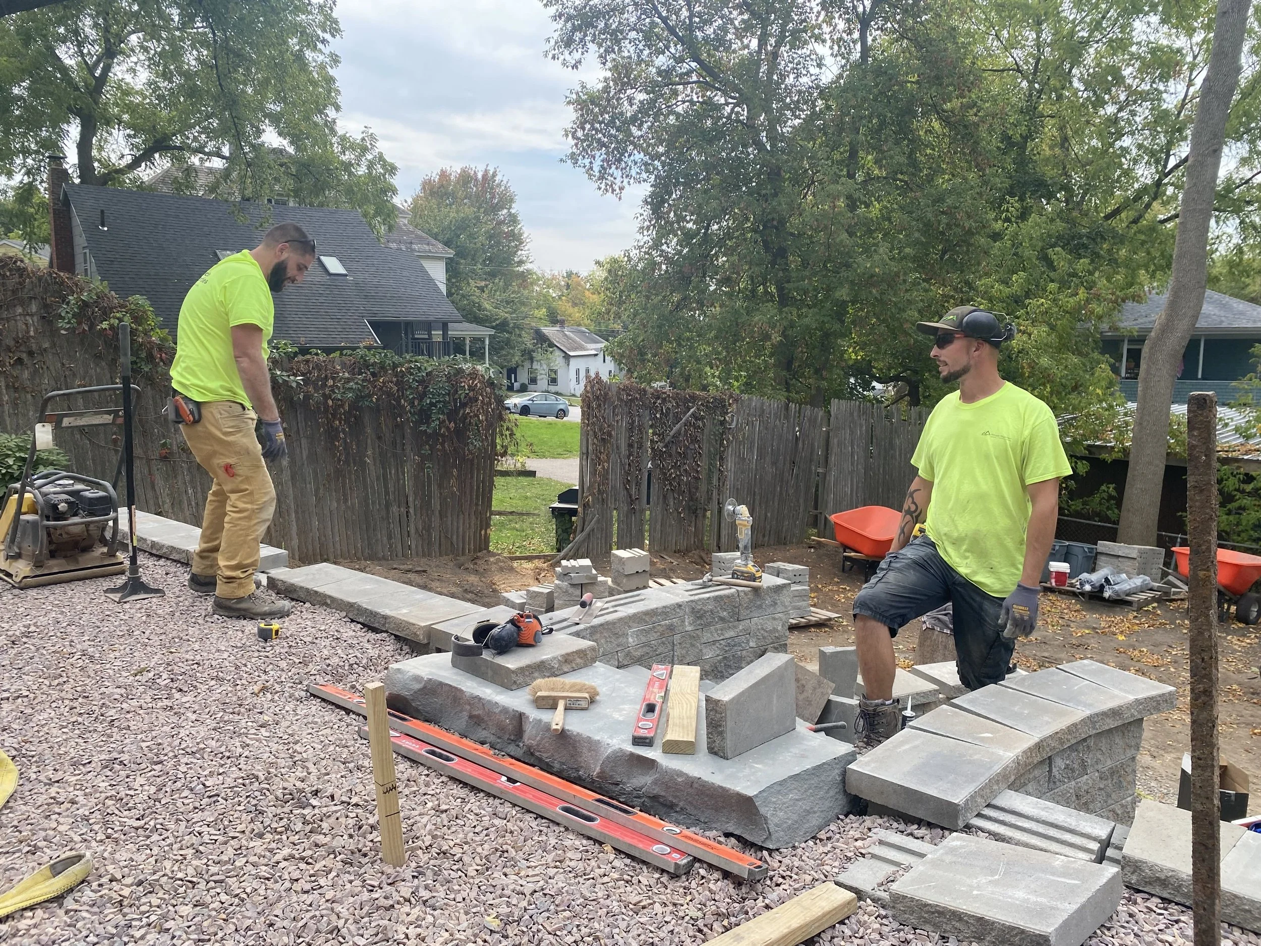 pinnacle properties crew installing a hardscape in vermont