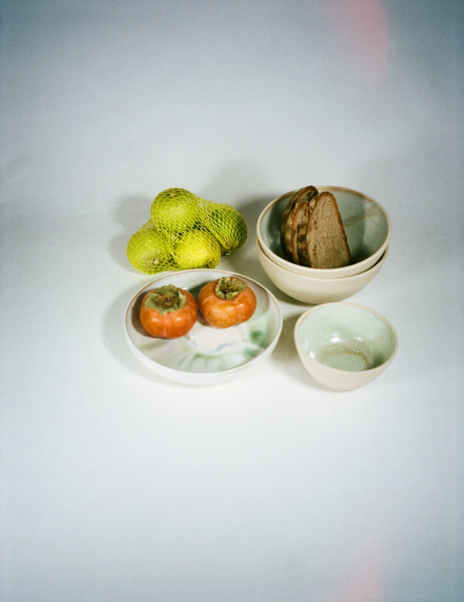 differently sized small ceramic bowls with food in them