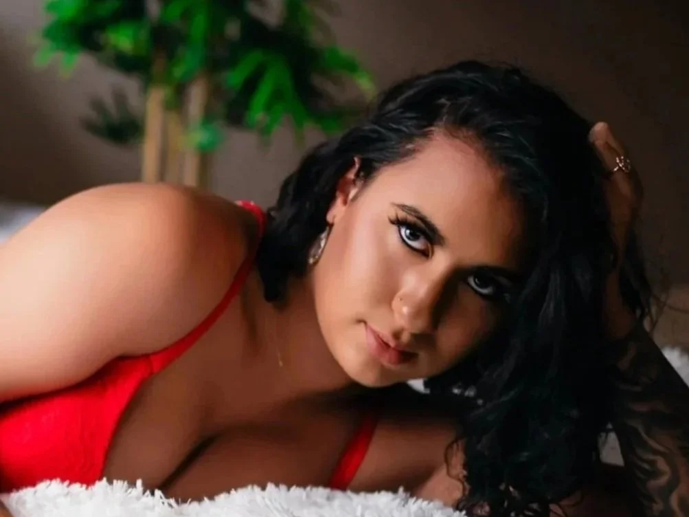 Boudoir photography session in South Jersey studio featuring a confident woman in a moody, cinematic setting