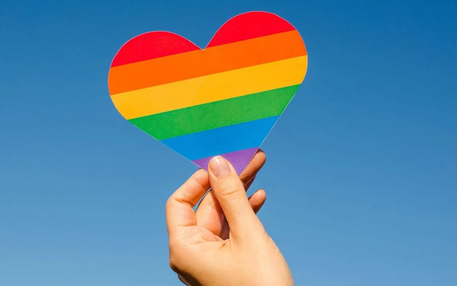 When Belonging Feels Uncertain: The Emotional Toll of Division on LGBTQ+ Coaches, Clients, and Our Profession