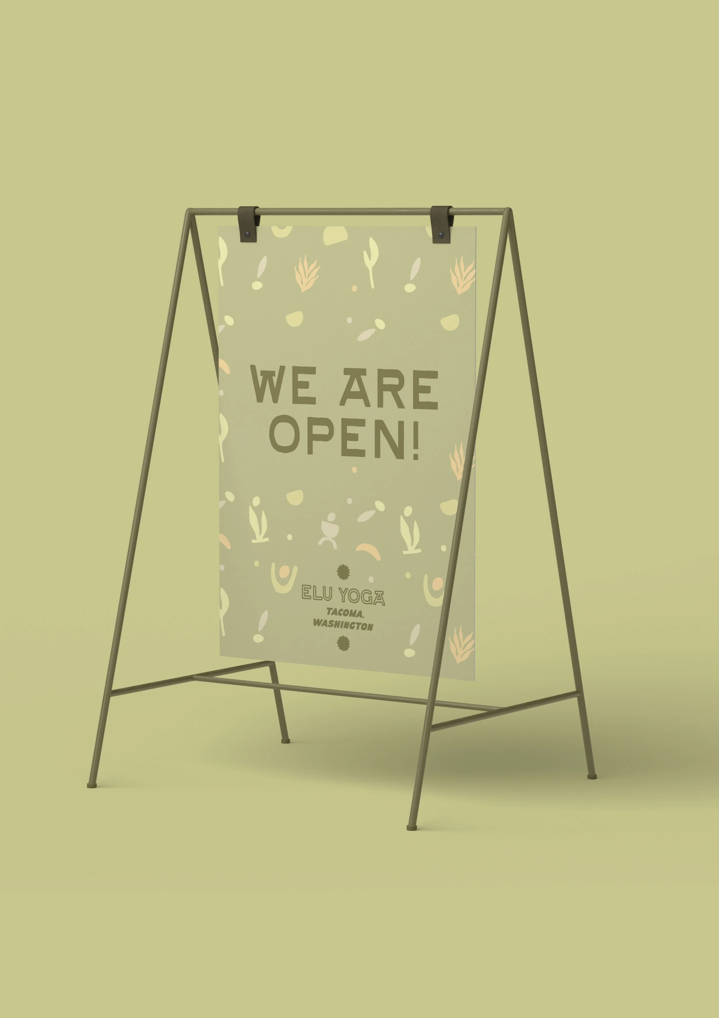 Elu Yoga sidewalk sandwich board with logo and studio information branding.