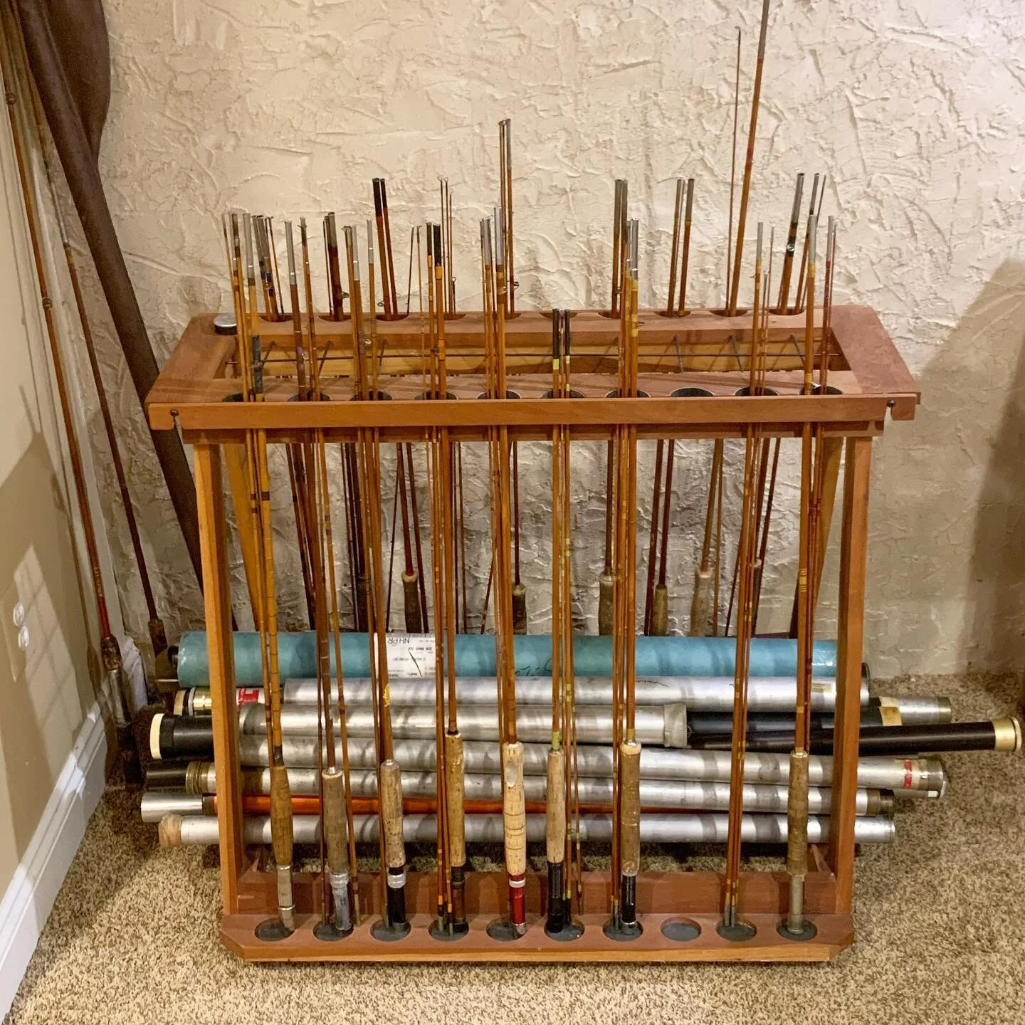 ▪️Original design &ndash; Fly rod Holder
 
Made with cherry salvaged from 150 year old folding table. Designed to hold fly rods as well as the tubes for storage. Fly rod tubes are pictured on the bottom; however, the empty ones are normally stored up