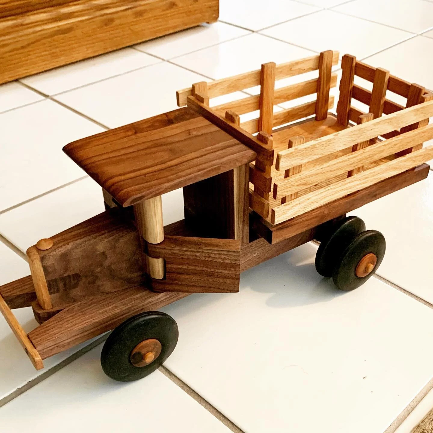 ▪️Handmade vintage toy truck 

Inspired by 1920&rsquo;s stake body farm truck. Made with walnut and red oak for contrast and vintage tires to enhance the aesthetic. 

A perfect gift for this little guy who loves anything with wheels! 

#handmadetruck