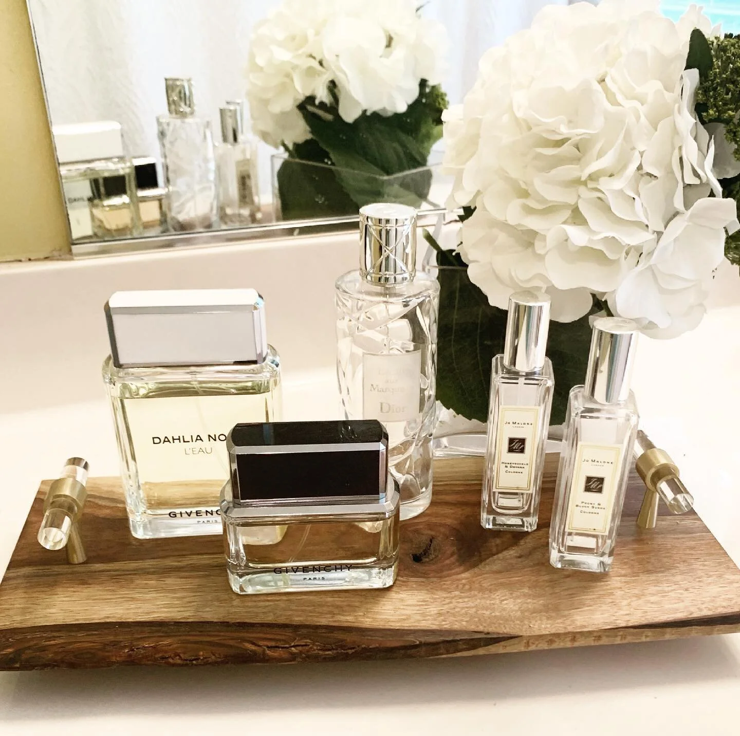 Petals + Perfume 🤍

Perfect combo for a vanity 

Designed &amp; handcrafted tray by myself &amp; @saww_nj 

#homedecor
#homeorganizing 
#handmade 
#perfume 
#customwoodwork 
#placeandpurpose