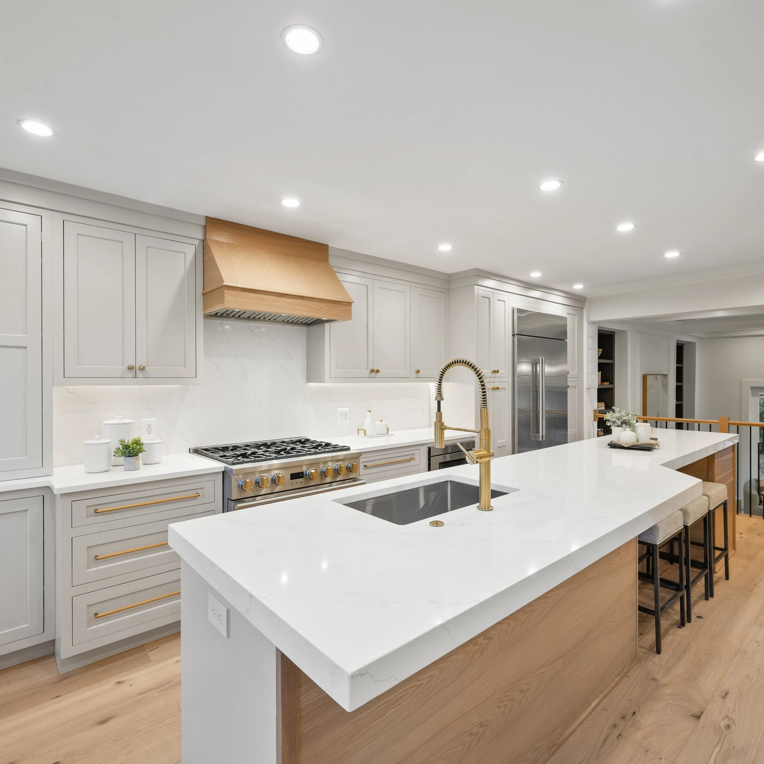 A kitchen designed to feel as good as it looks - warm white cabinetry, a natural wood island, and gold accents that elevate every detail ✨🏡

#KitchenDesign
#Kitcheninspo #CustomCabinets #LuxuryInteriors #WoodandWhite #KitchenGoals #GoldFixtures
