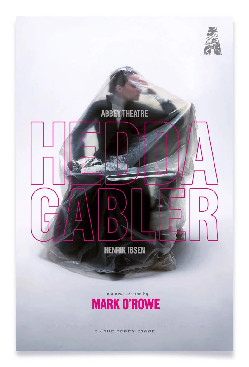 Poster for 'Hedda Gabler' at Abbey Theatre featuring a woman sitting inside a clear plastic bag with her hand on her forehead, and text in pink and black.