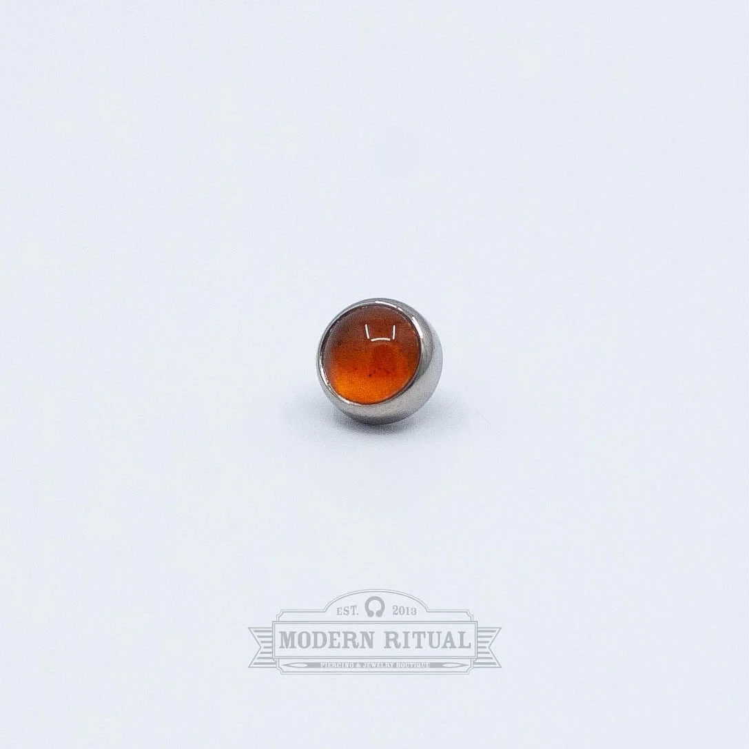 For our orange lovers! We have a pair of these Titanium Baltic Amber Cabochons from @industrialstrength still in stock, come grab them for this Fall before they are gone. Reba and Logann are in the shop until 7 tonight, stop on in! 

#fallleaveschang