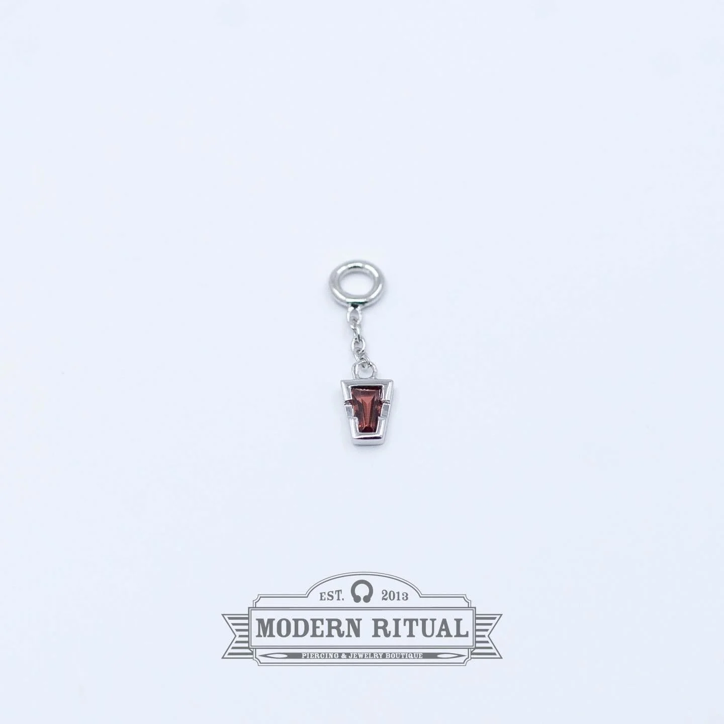 Add a little extra something to your existing jewelry with cute charms like this White Gold Linda Charm with Garnet from @tetherjewelry ! Time is running out for holiday shopping so make sure to stop in and grab those last minute gifts and gift cards