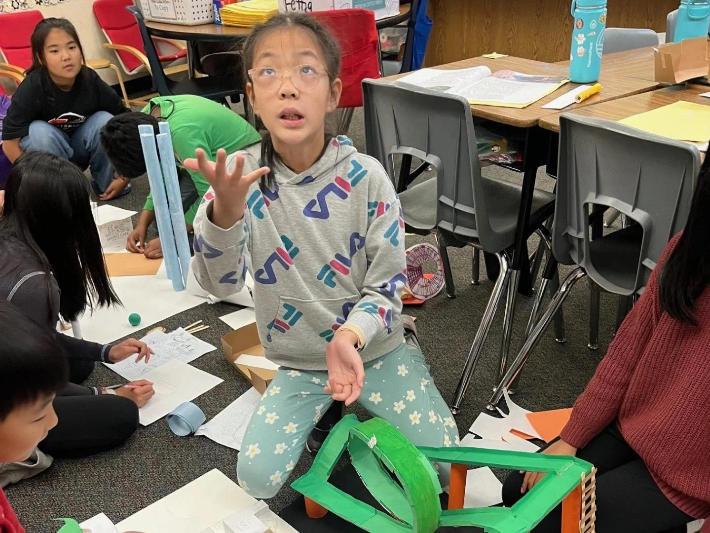 A student engages with materials provided by Energy is Everything for the "Amusement Park of Dreams" lesson on electrification