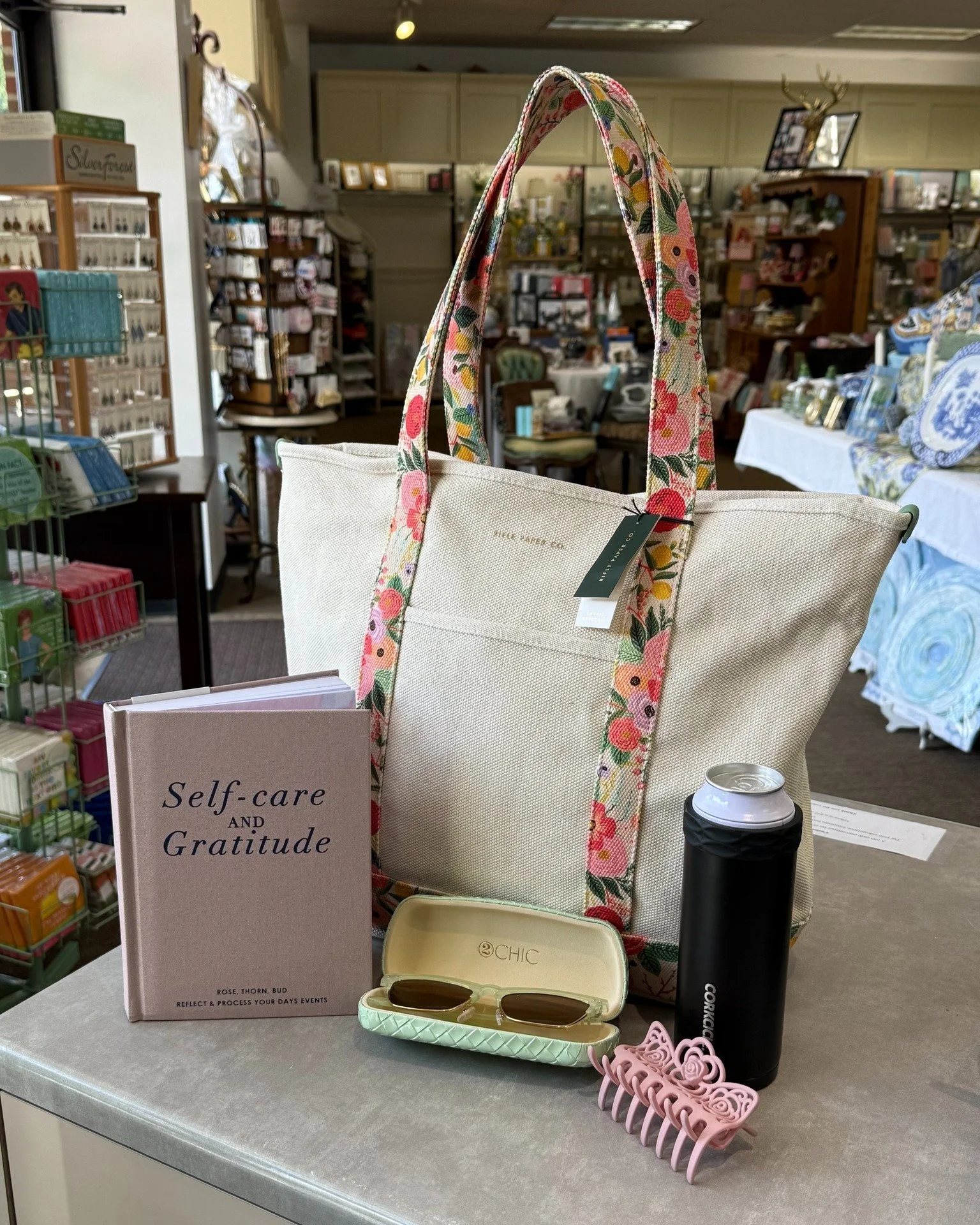 A lot goes into curating the *perfect* beach day: a good book, an ice-cold drink, cute sunglasses, hair up, and a bag that carries it all beautifully ☀

 #beachday #summer #riflepaperco #corkcicle #2chic #shoplocal #lynchburgva