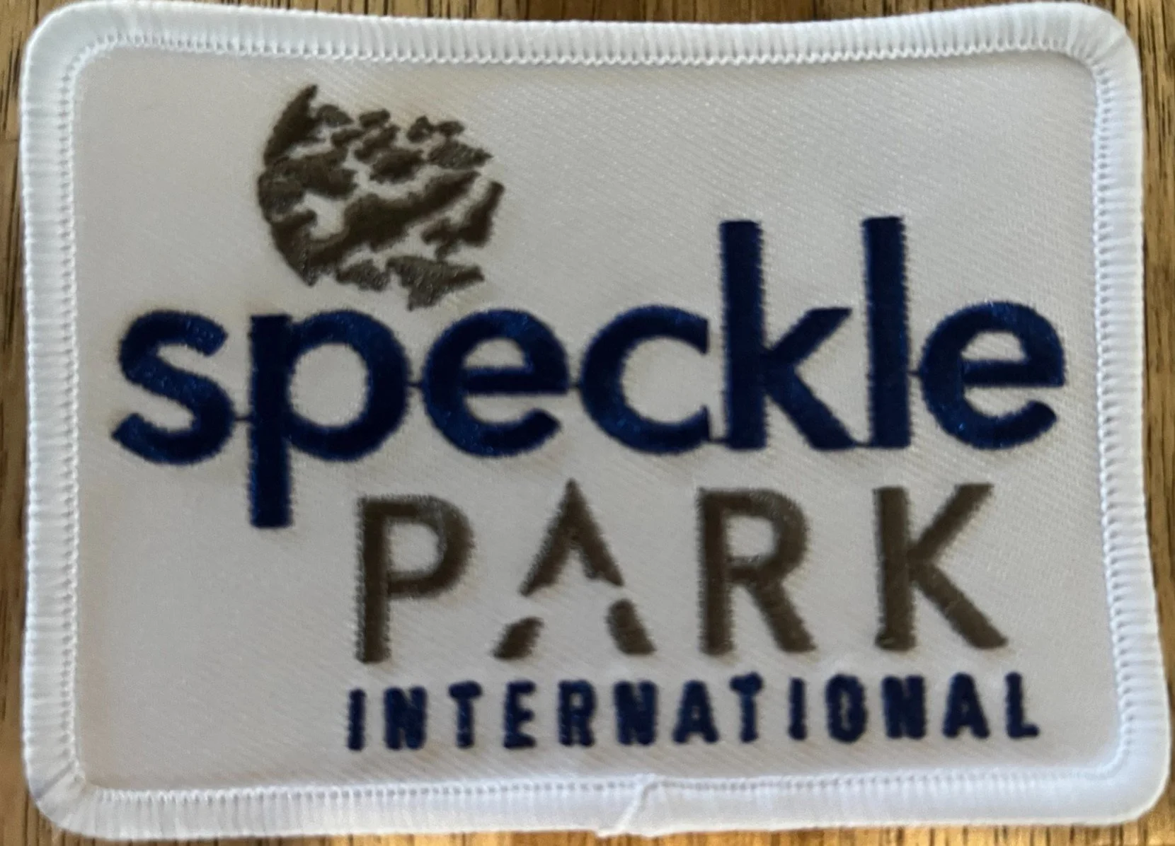 SEW ON SPI Logo patch for white shirt