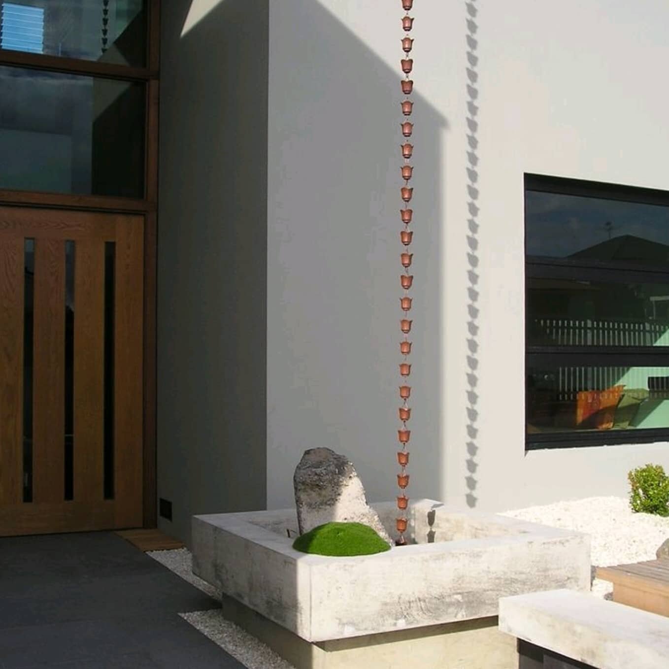 Whangaparaoa catchment basin and rain chain