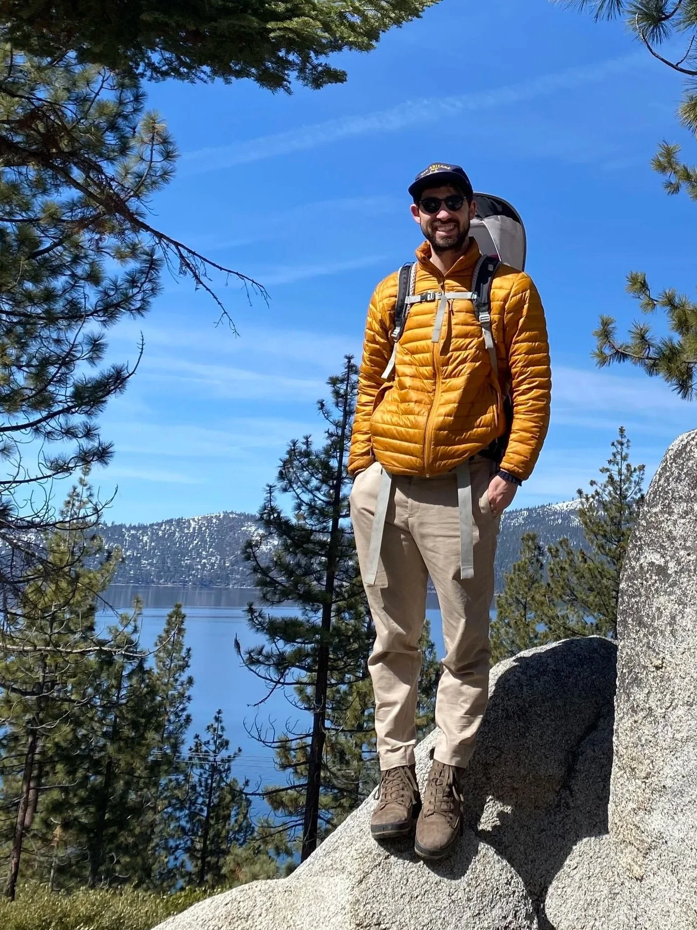 Jacob standing on a boulder above Lake Tahoe.