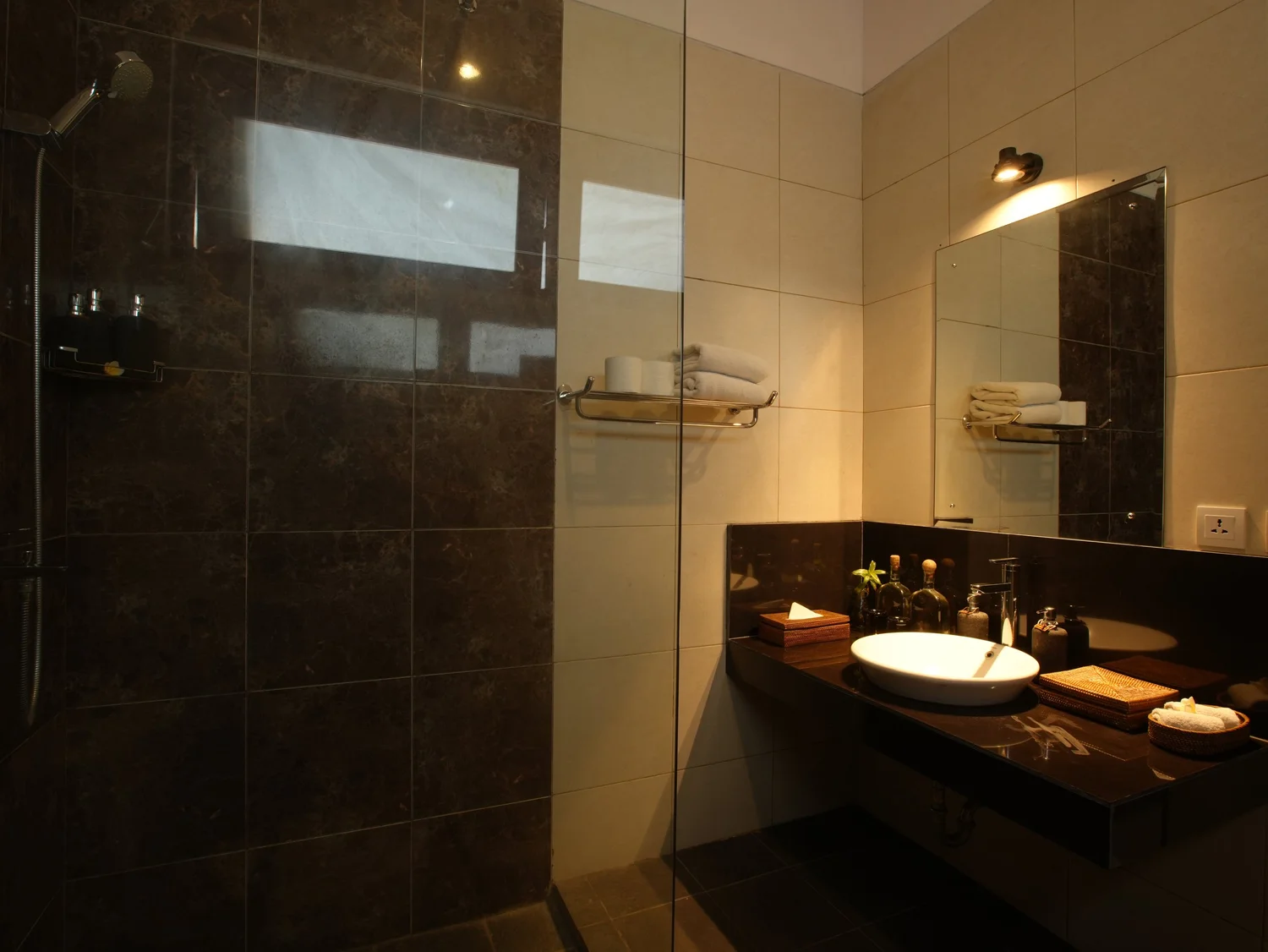 Modern stone-tiled ensuite with rainfall shower