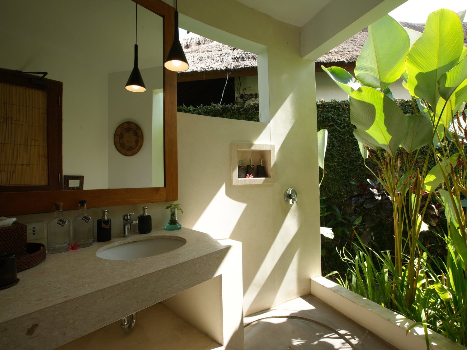 Open-air bathroom with tropical garden