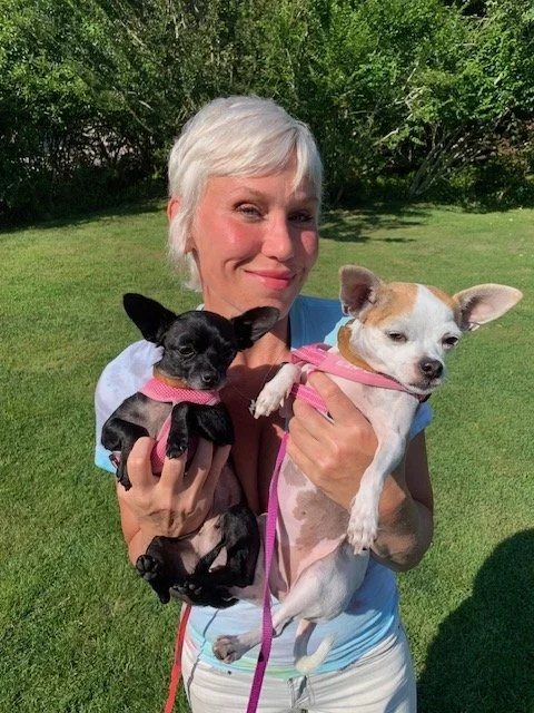 Dr. Lila Wolfe holding her two small dogs