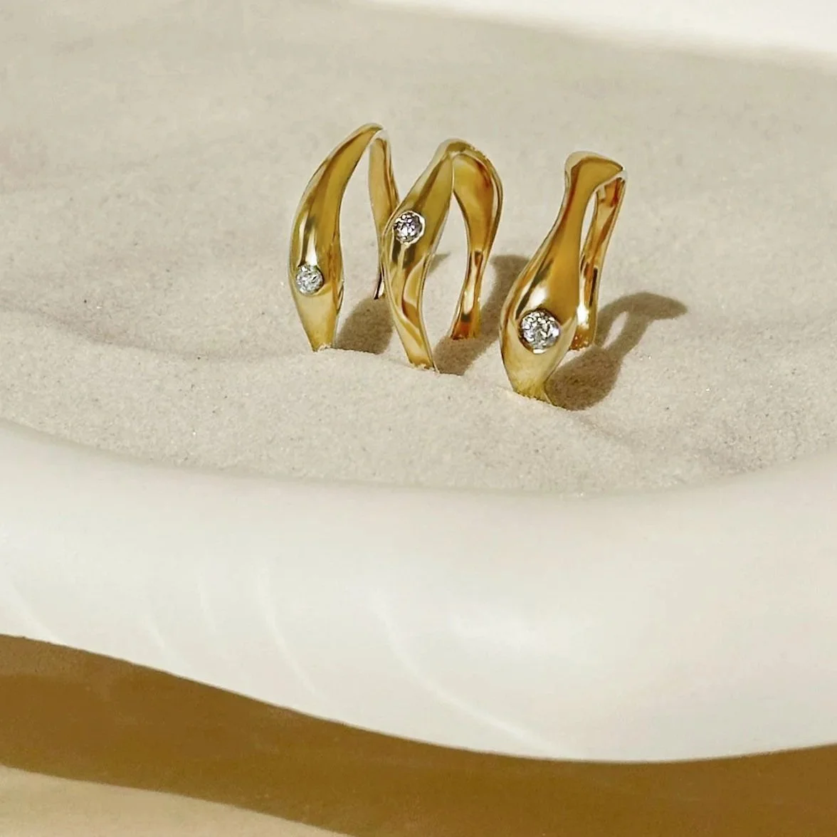 Flowing set of 18 carat gold and antique diamond stacking rings redesigned into new organic, fluid shape