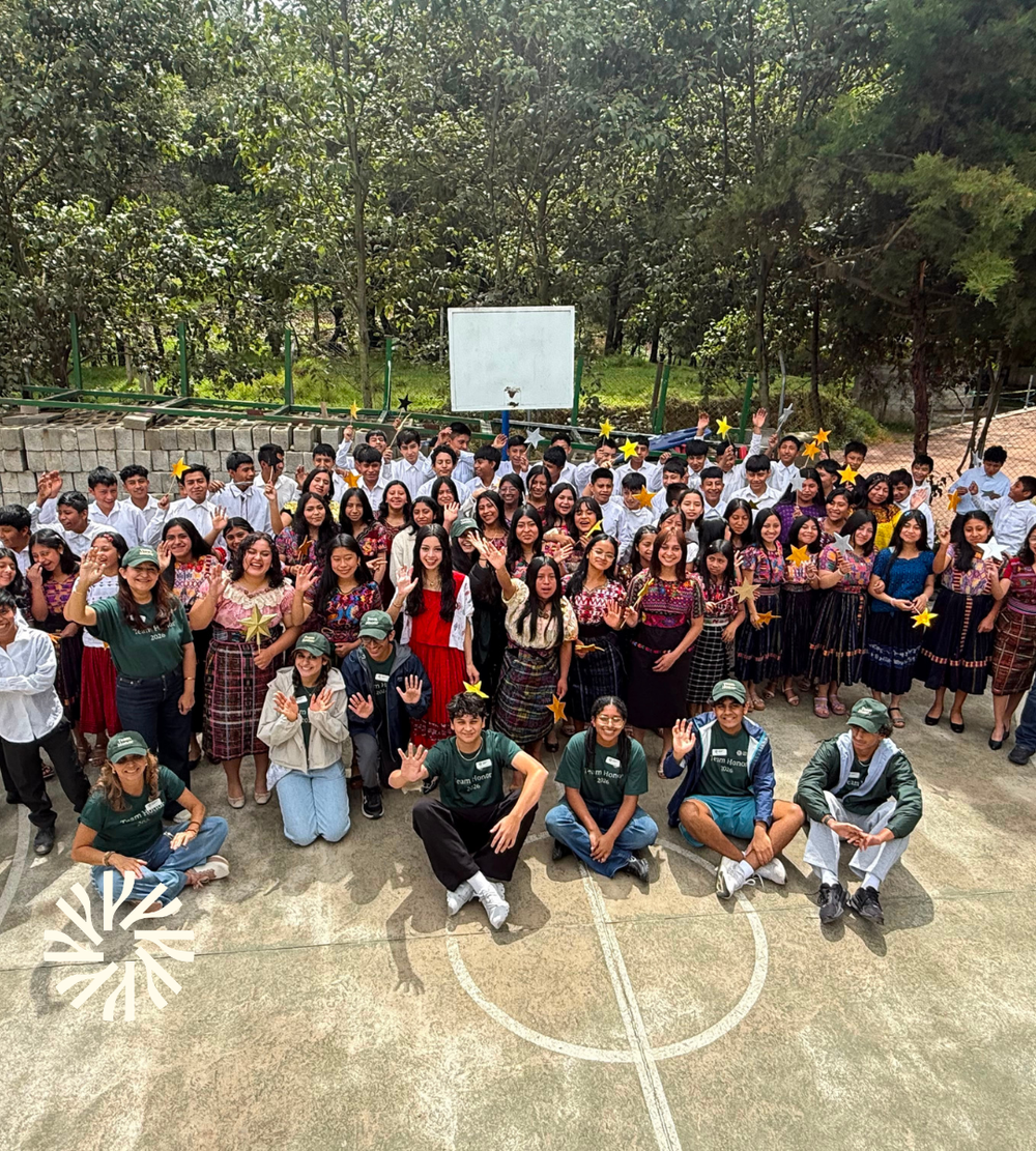 Team Honor volunteers with students during a visit to IEP education programs in Guatemala
