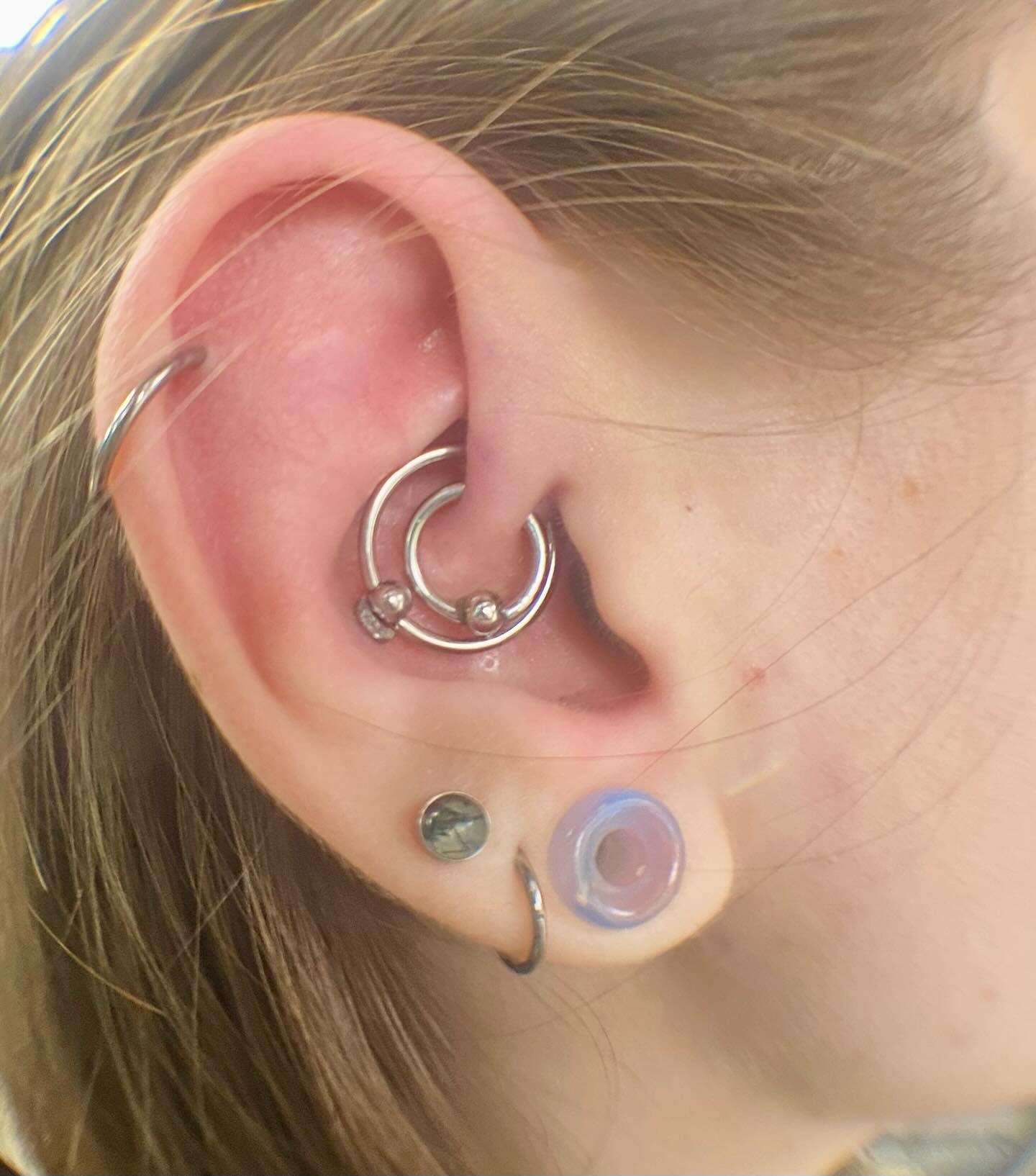 Super fun double daith on belle! We added the outer ring today✨ #doubledaith #daithpiercing #bodypiercing done by @steriletaryl_thl