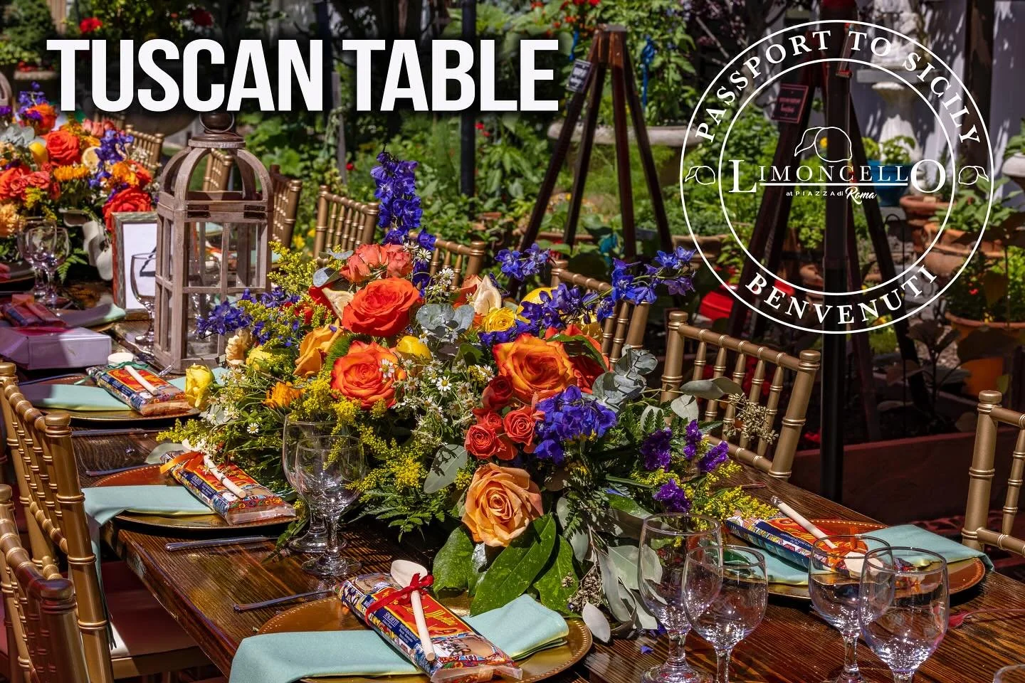 Elegant outdoor table setting with a vibrant flower centerpiece, glassware, napkins, and colorful decorations, set for a celebration or gathering.