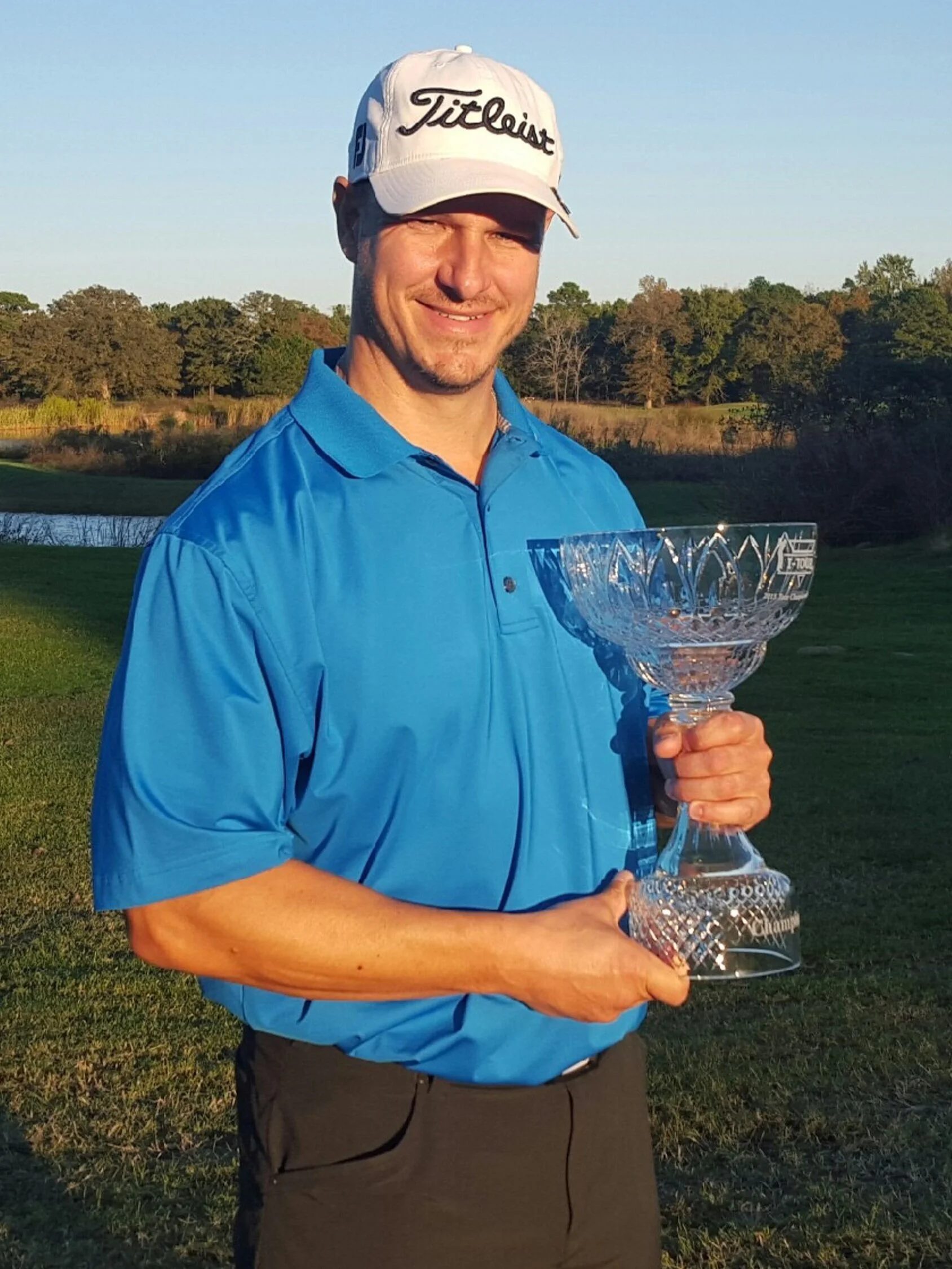 Portrait of pretty Caucasian therapist in elegant dress and smiling while standing at modern office.