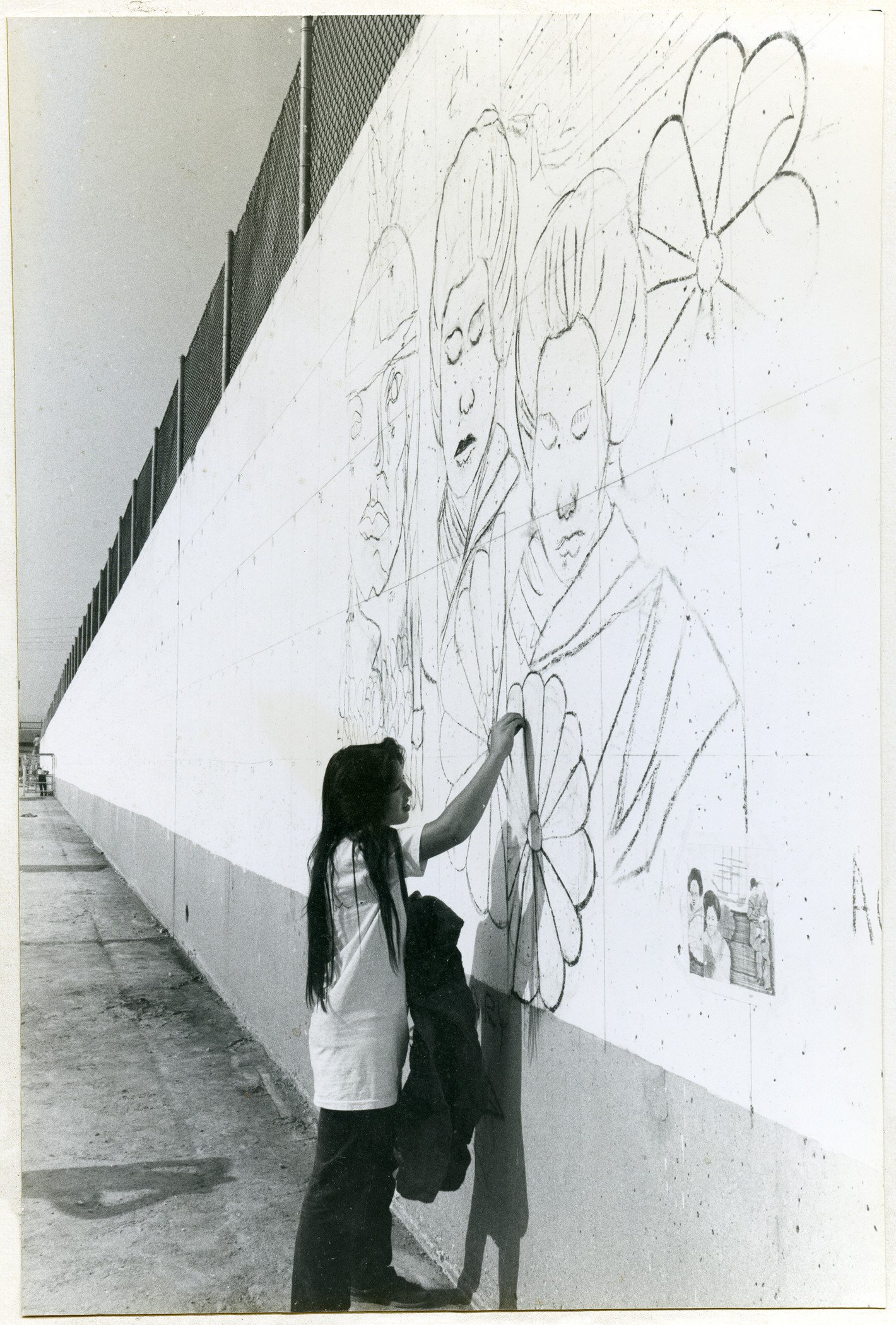  Sketching on the wall at  The Great Wall of Los Angeles ,&nbsp;© SPARC 1976, courtesy of Judith F. Baca and the SPARC archives. Photo: Linda Eber, 1976. 