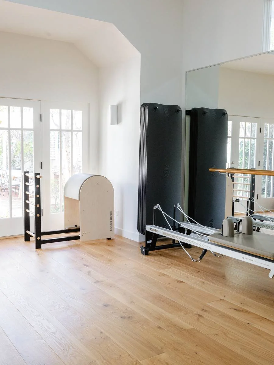 Ladder barrel, mats and a reformer by the French doors