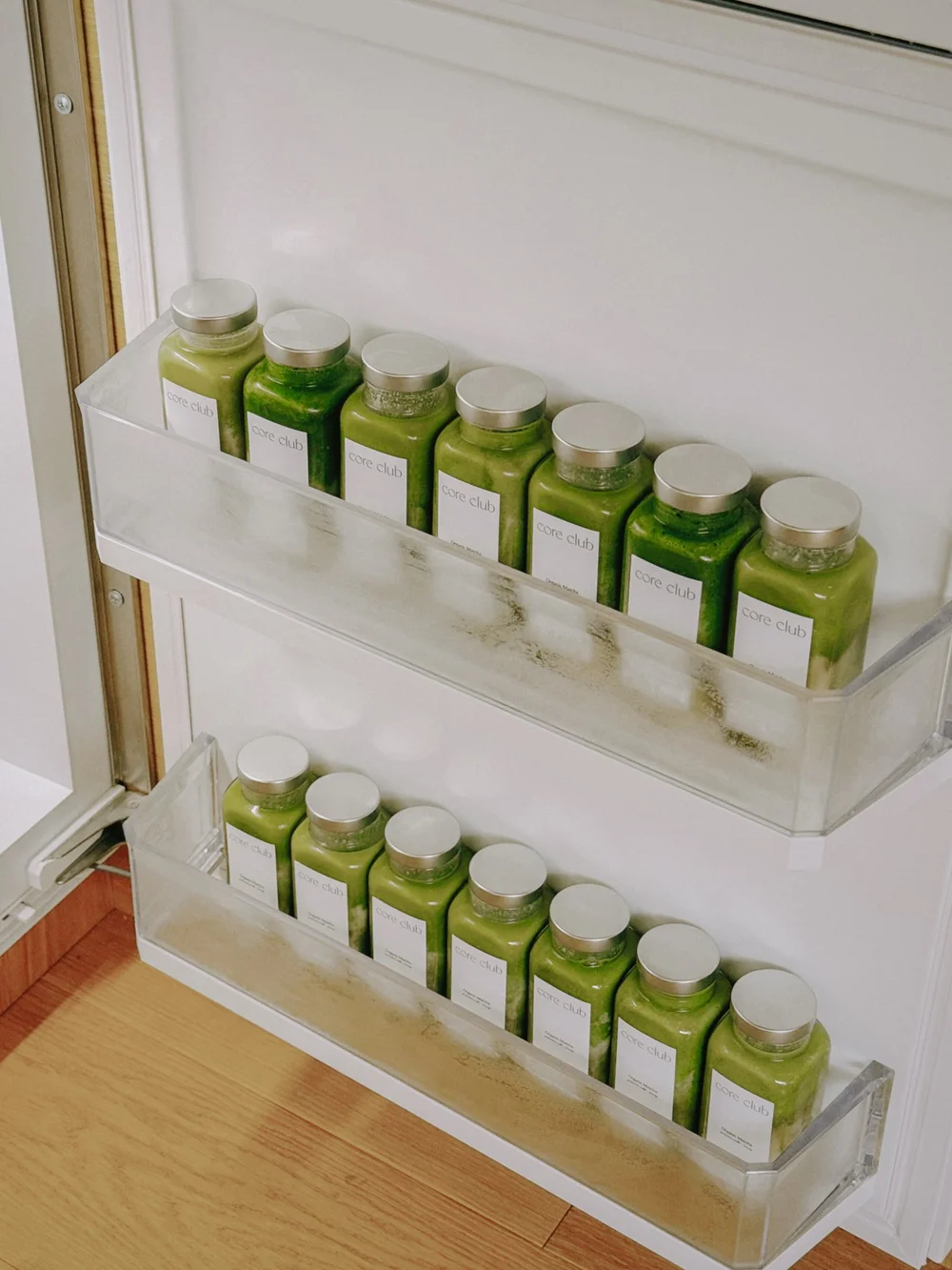 Bottles of Core Club matcha in the fridge