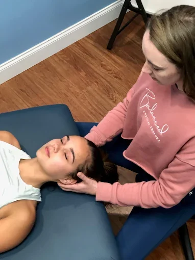 Patient working with a provider at a physical therapy and Pilates clinic in Charlotte, NC
