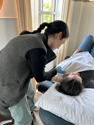 Patient working with a provider at a physical therapy and Pilates clinic in Charlotte, NC