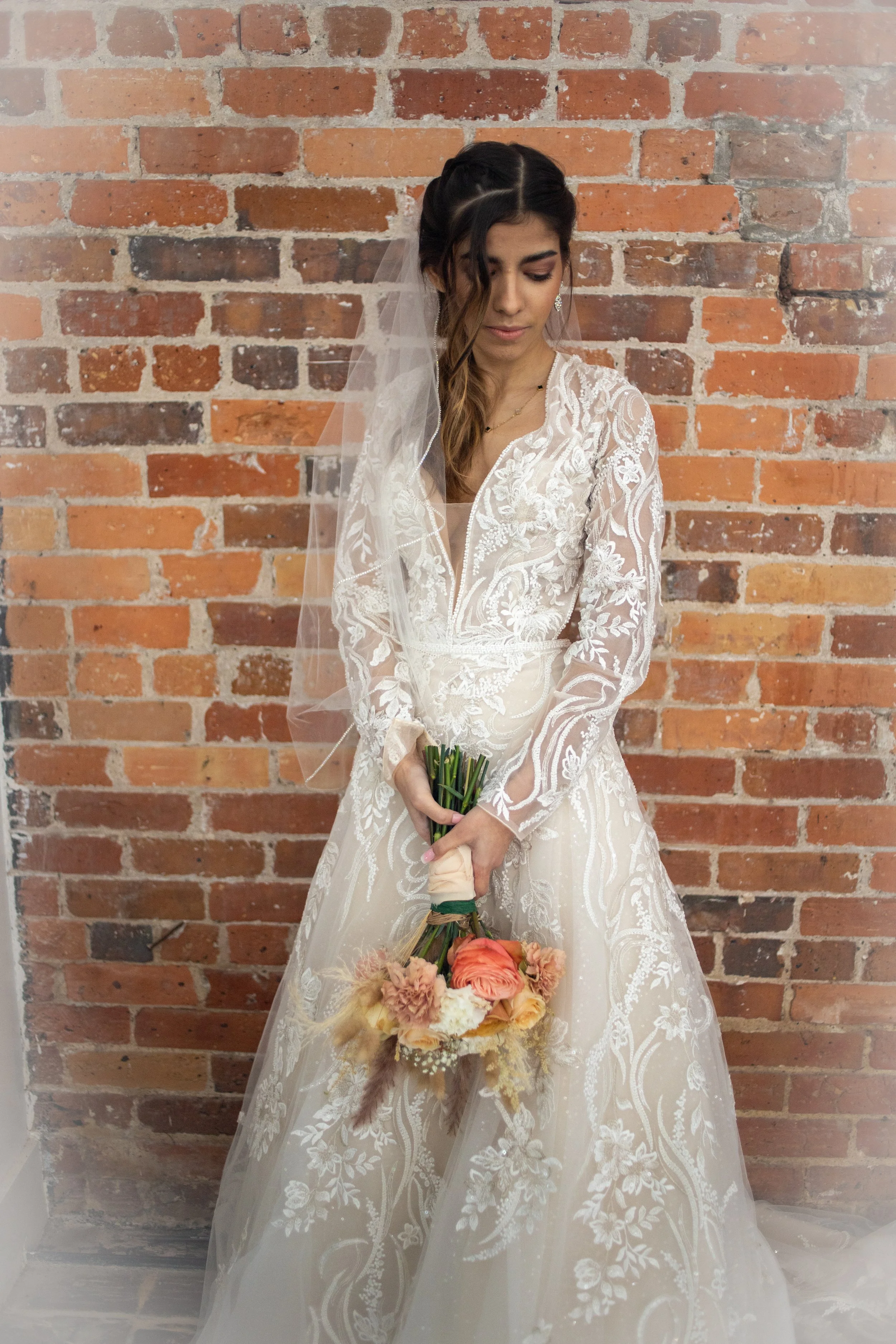 Justin Alexander Signature Higgins
Plunging long sleeve V-neck A-line with side removable cutouts and keyhole back
Size 8 $1737