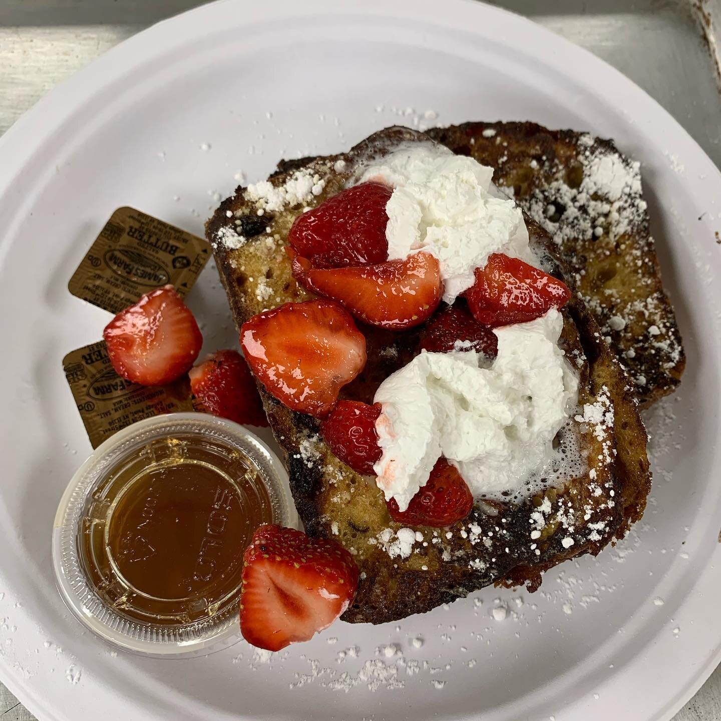 Homemade Cinnamon raisin French toast topped with strawberries and whipped cream. Breakfast served in till 12!