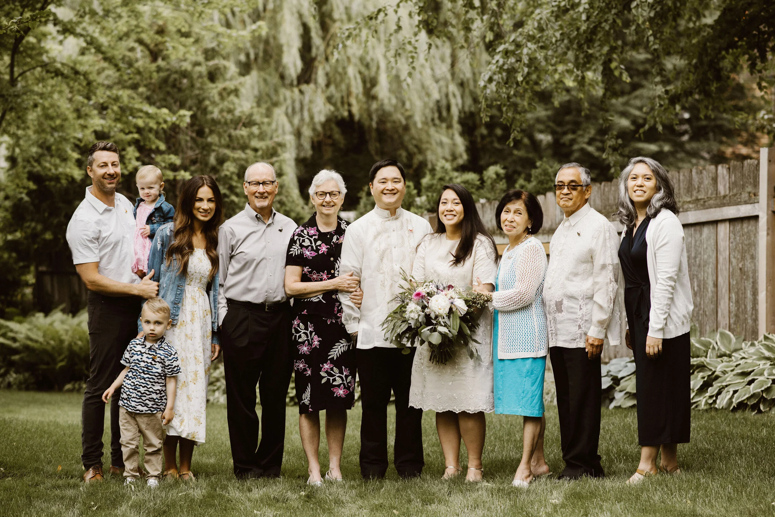 L to R: Cory (Drew’s brother), Sutton (Drew’s niece), Lachlan (Drew’s nephew), Courtney (Drew’s sister-in-law), Mike (Drew’s father), Bev (Drew’s mother), Drew (groom), Samantha (bride), Tita (Samantha’s mother), Gene (Samantha’s father), and Steph …