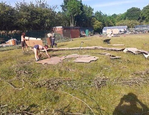 Another spiral garden! Our volunteers have been building a lasagne hugel bed. After marking out the spiral we lay cardboard to kill off grass and weeds underneath, then we place a water retaining wooden layer. Next we create a compost mount along the