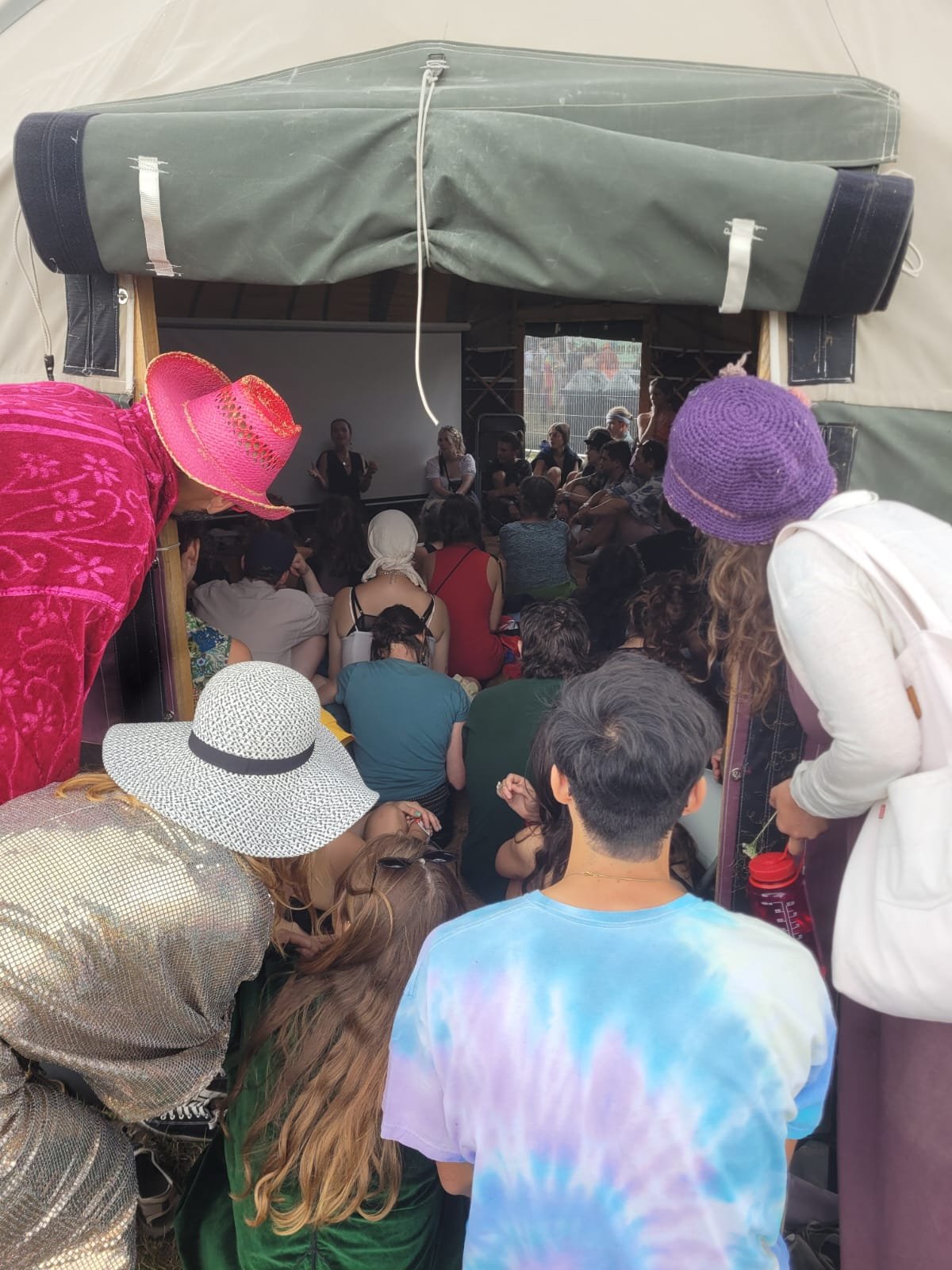 Busy tent at Shambala Festival, on a workshop about medicinal herbs, their folk laws, histories and uses.