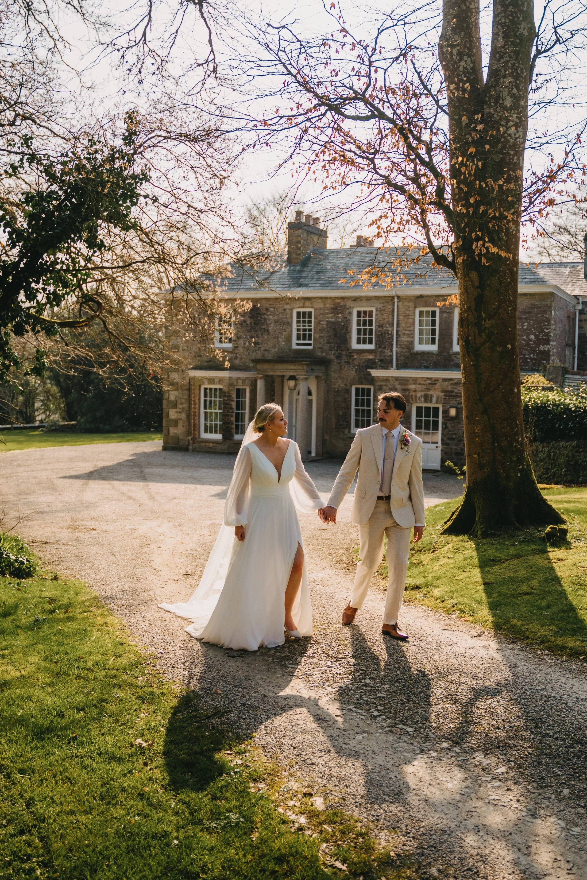 boconnion-wedding-venue-cornwall-couple-walking.jpg