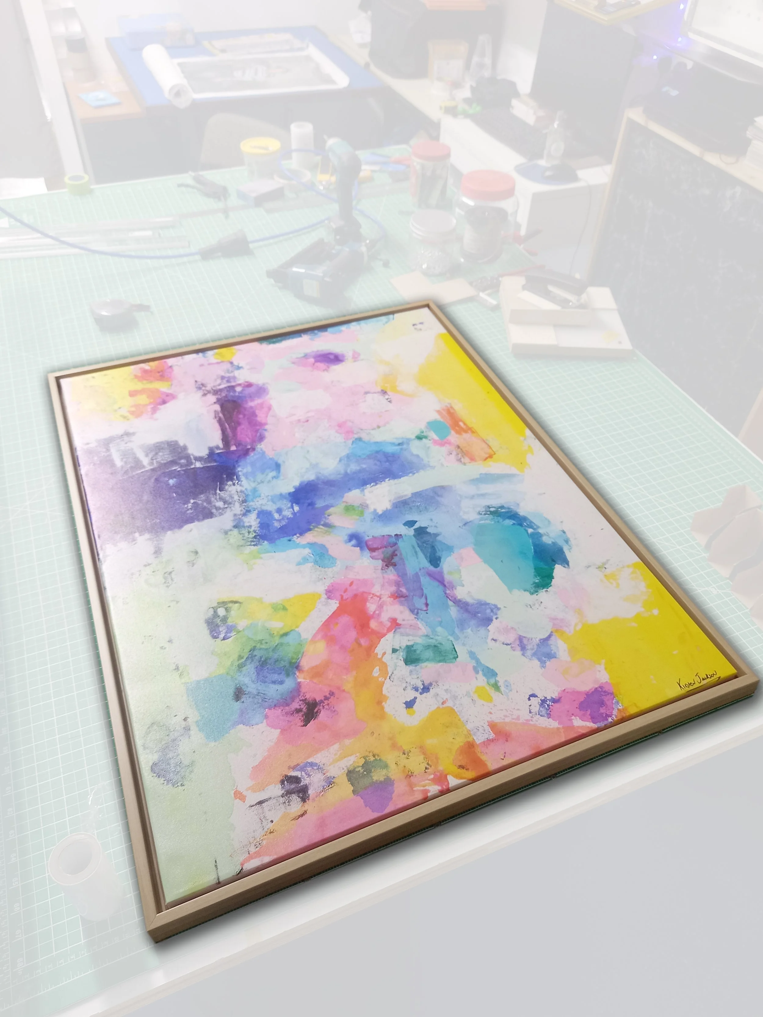 Colorful abstract watercolor painting in a wooden frame, signed in the bottom right corner.