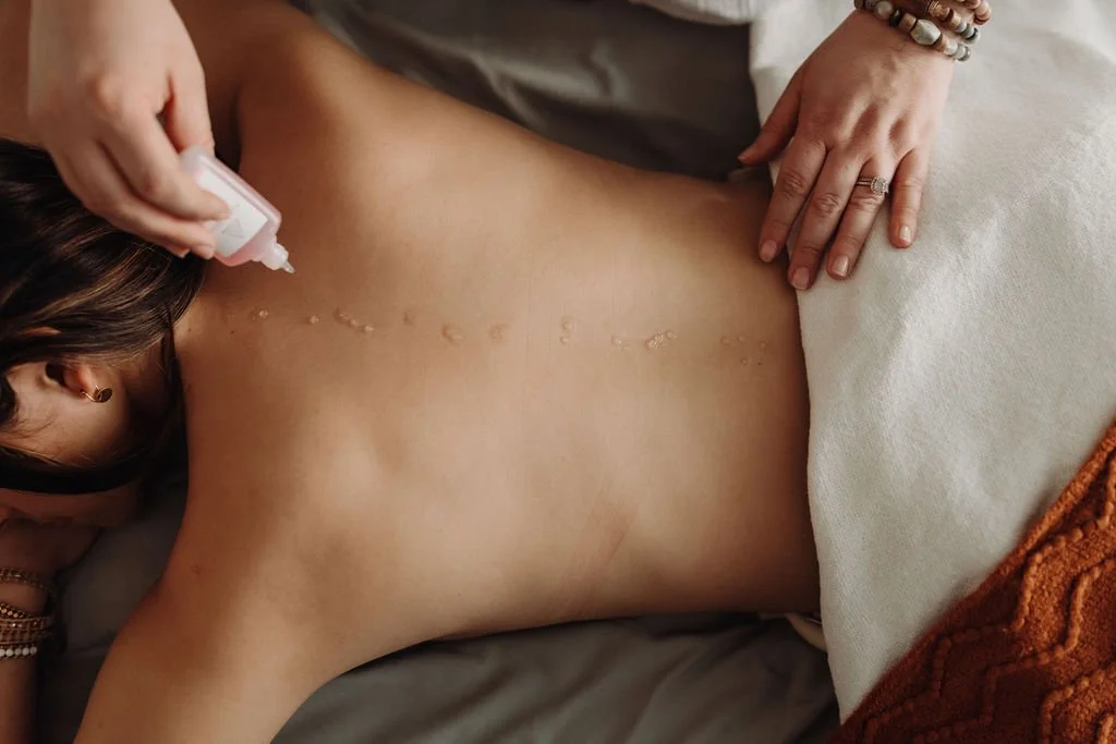 Person lying face down on a Reiki table