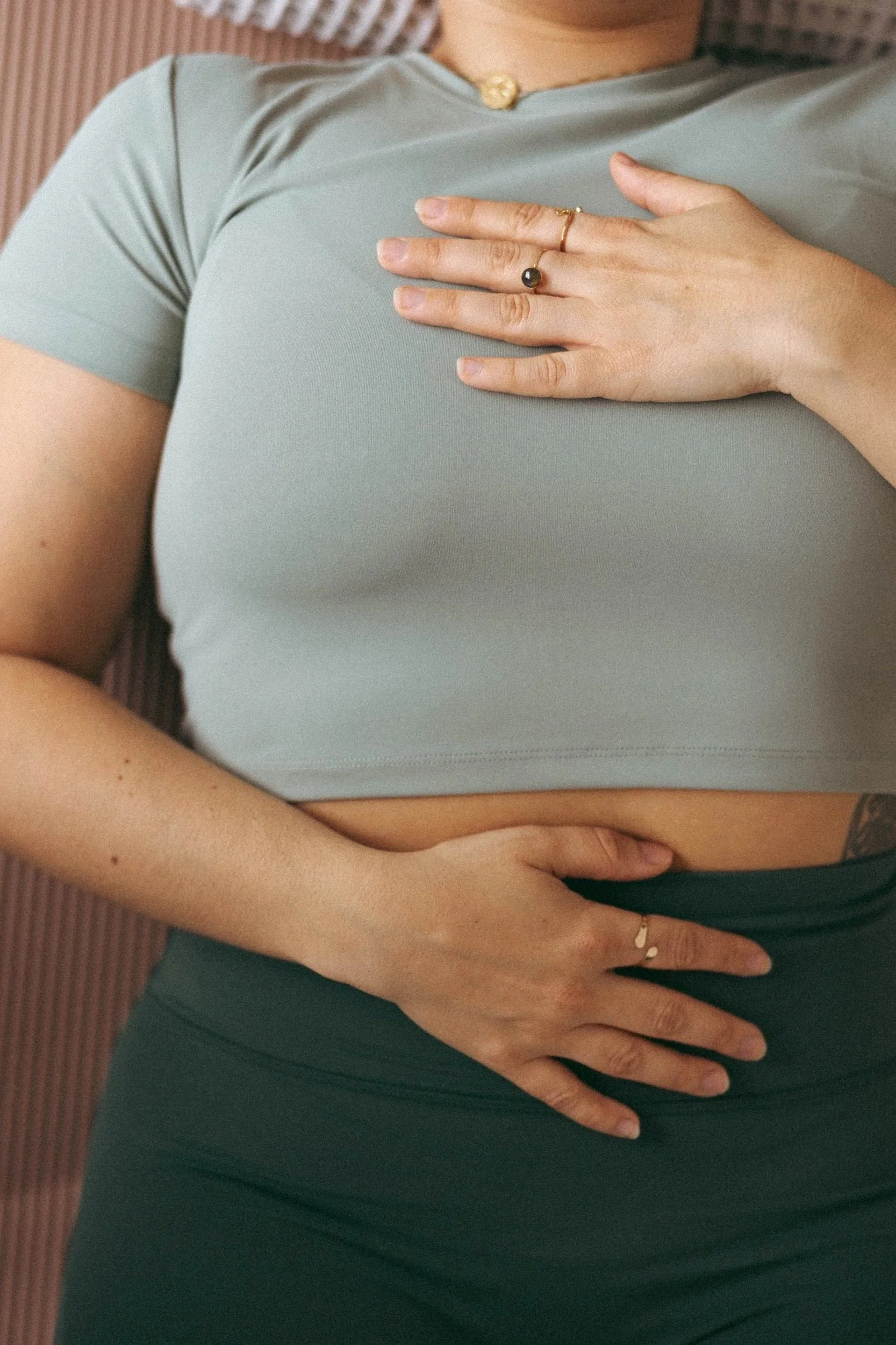 Woman with her hand on her heart
