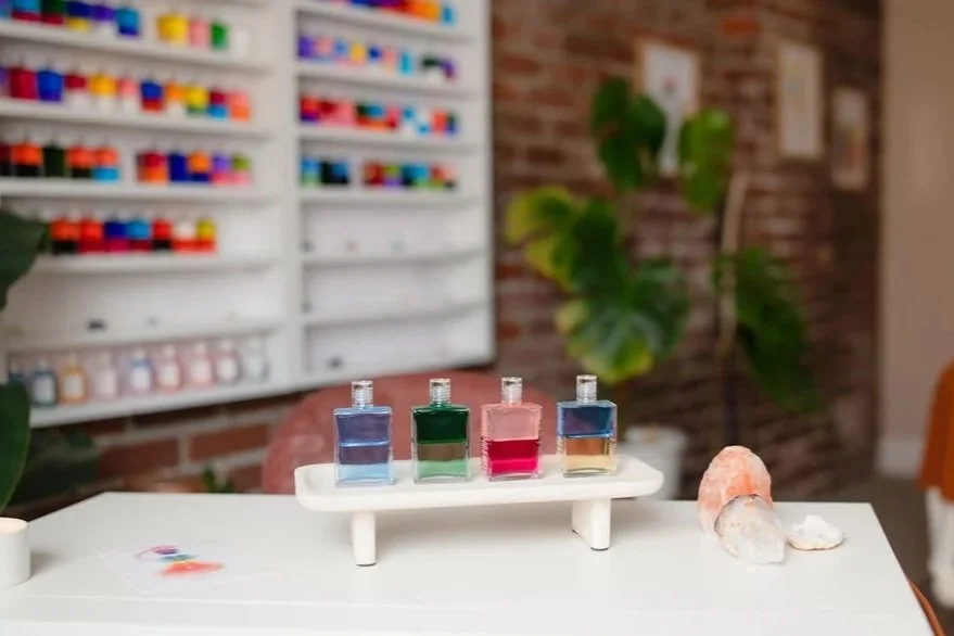 Four colored bottles in a row