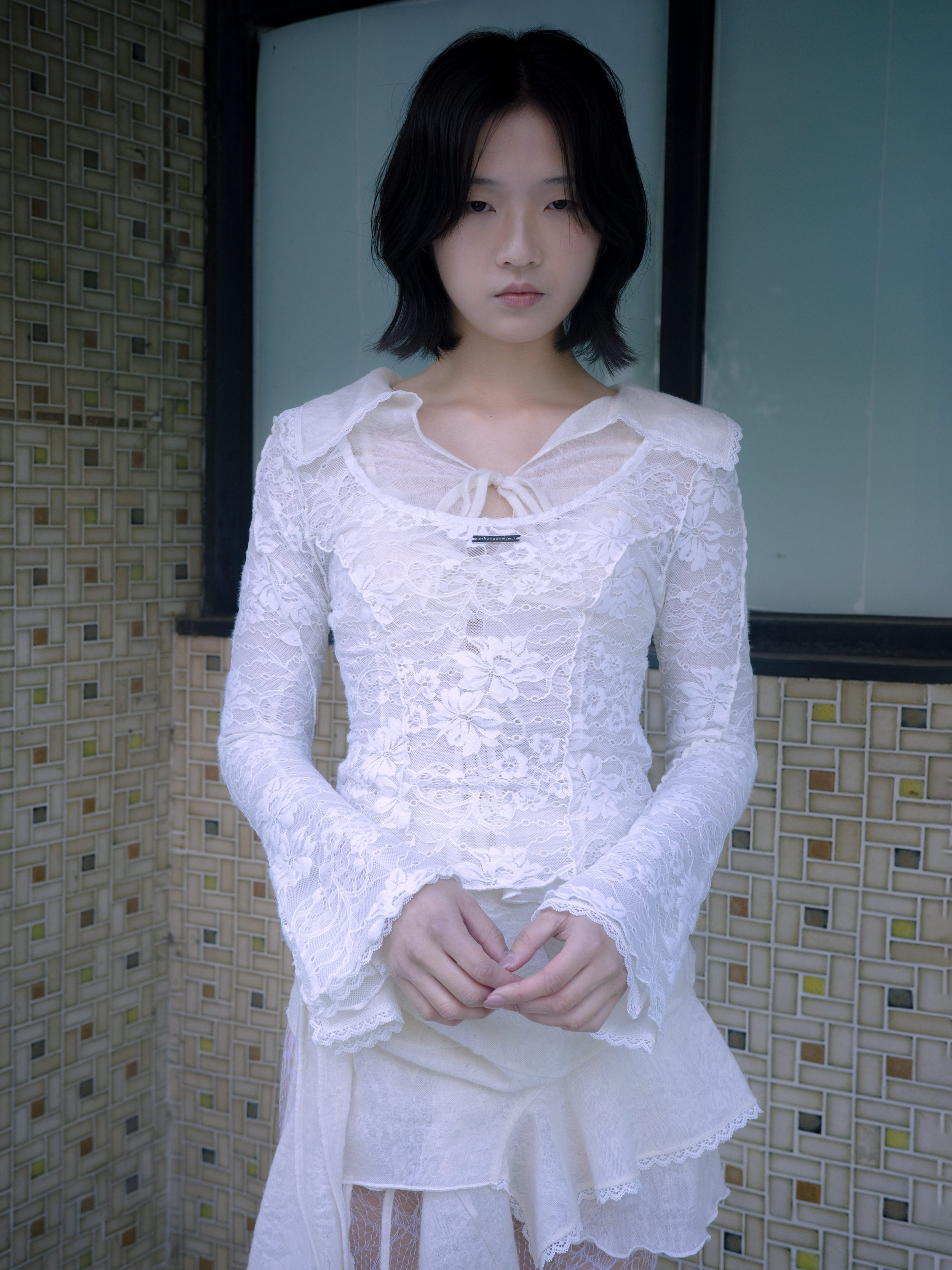 A women in layering white lace set, which is romantic and feminine 