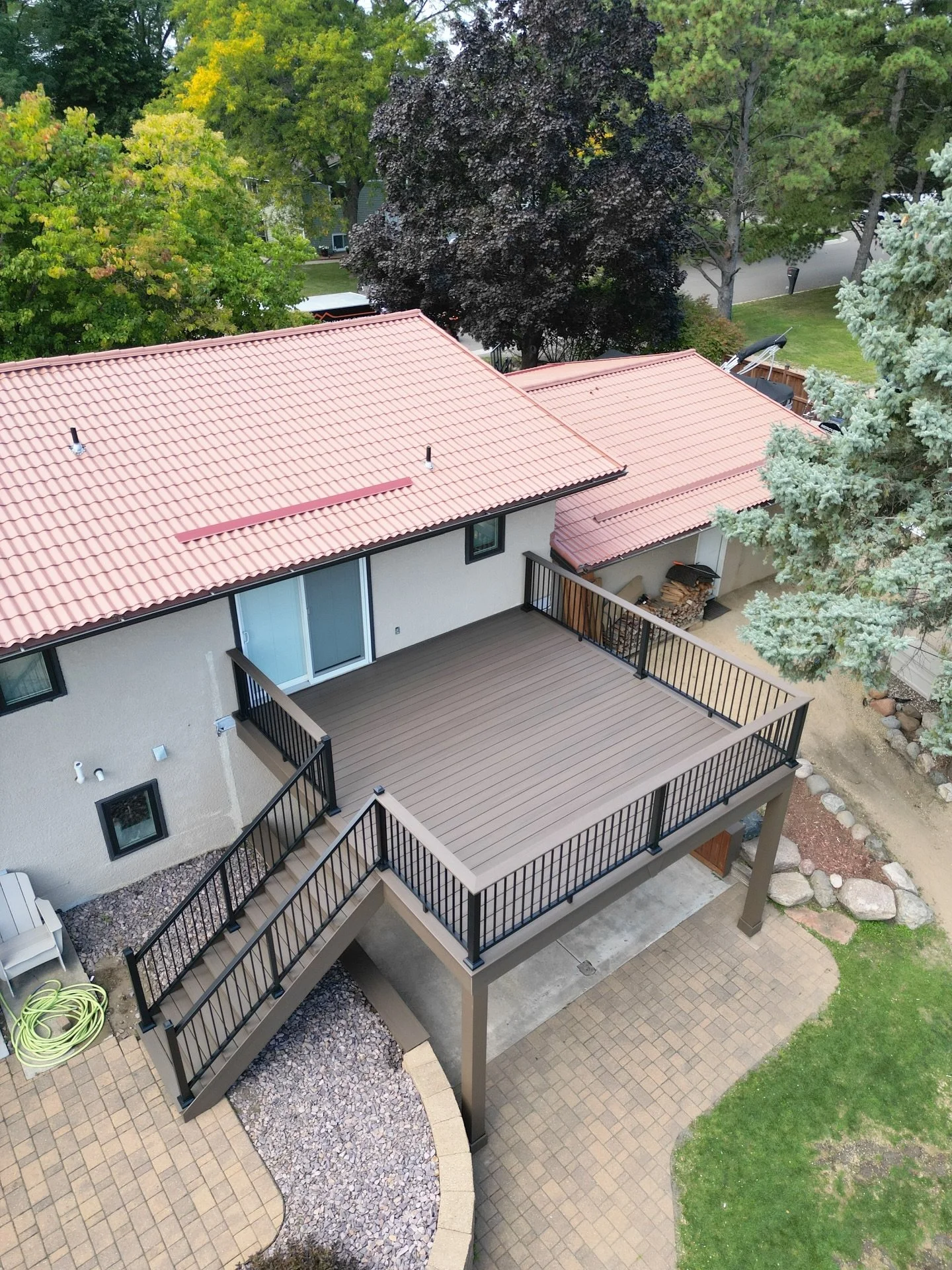 Fall feels even better from here 👀🍁🍂
&bull;
&bull;
This deck features @timbertech Advanced PVC in the American Walnut color 🇺🇸🌰
&bull;
&bull;
#newdeck #safe #strong #twinbros #teamwork #hustle #decks #mn #construction #builders #backyardvibes #