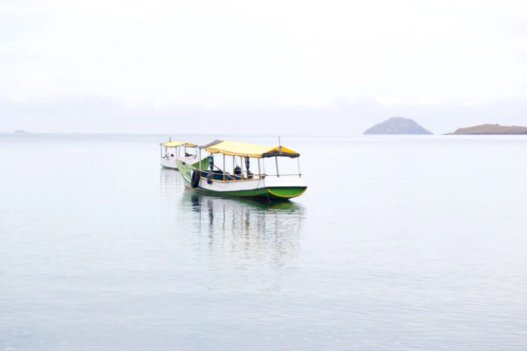 Traditional Indonesian boats floating on calm water near Komodo