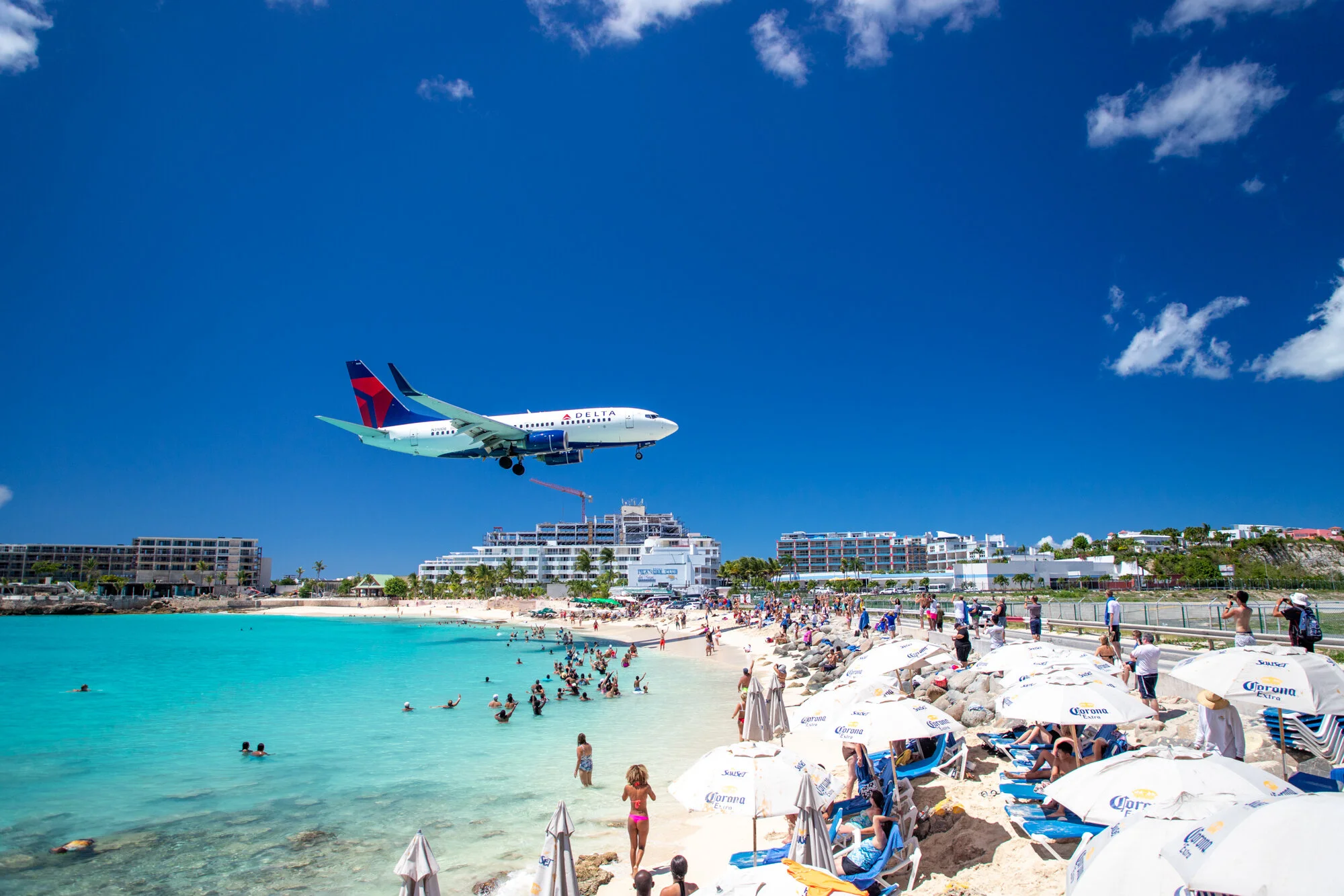 Delta Air Lines jet on final approach above Maho Beach, St. Maarten