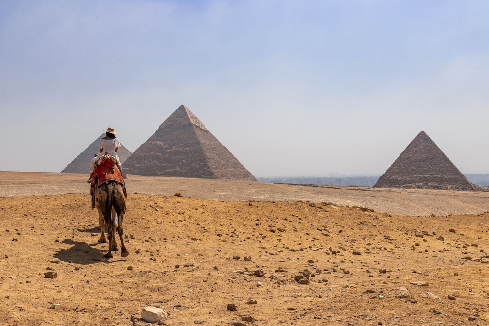 Amanda Riding the Camel at the Pyramids