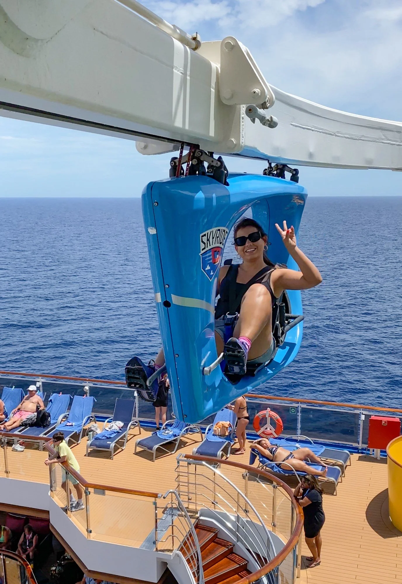 Passenger riding SkyRide above the upper deck of Carnival Horizon