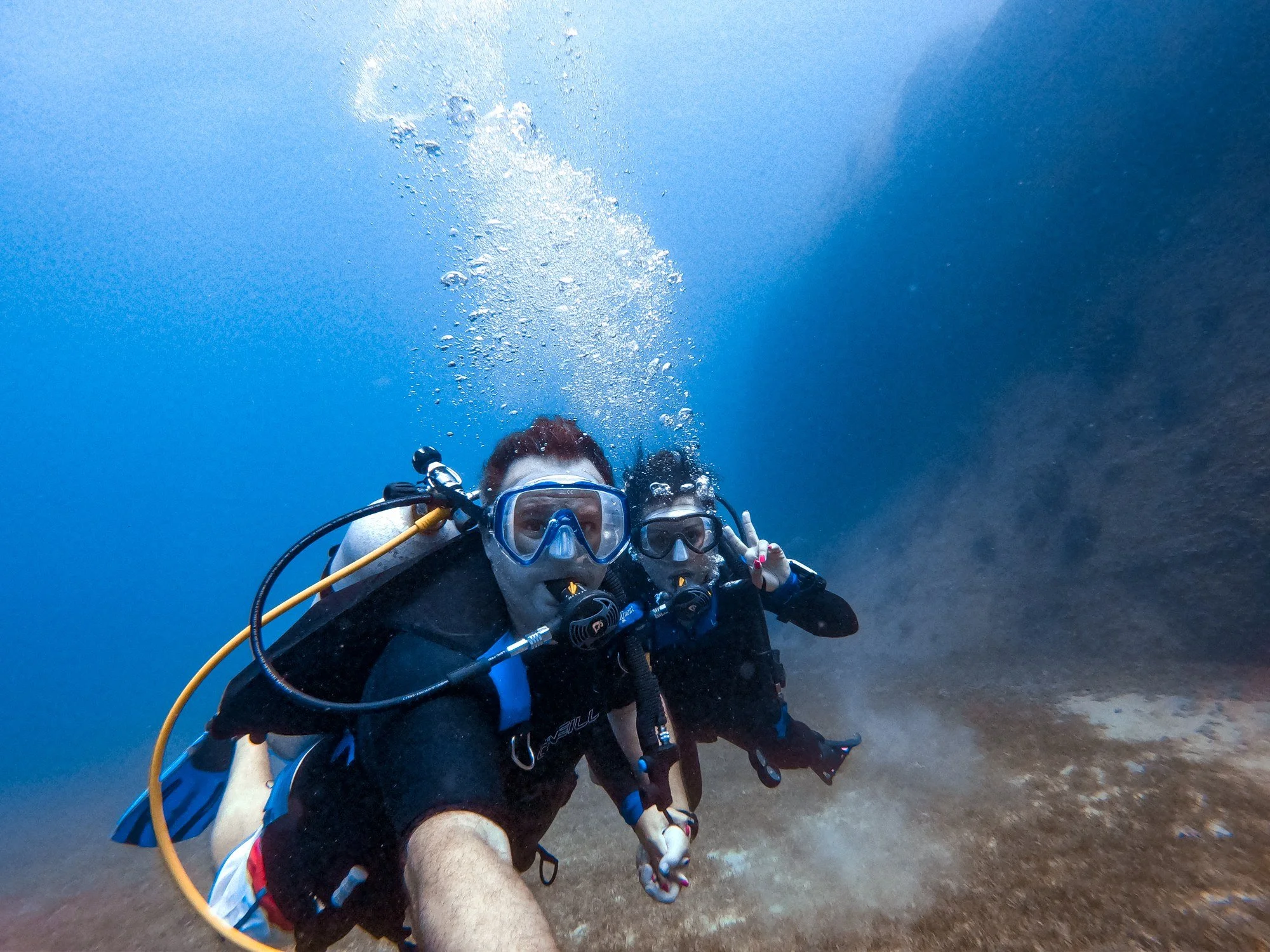 Scuba diver underwater near the Antilla shipwreck in Aruba