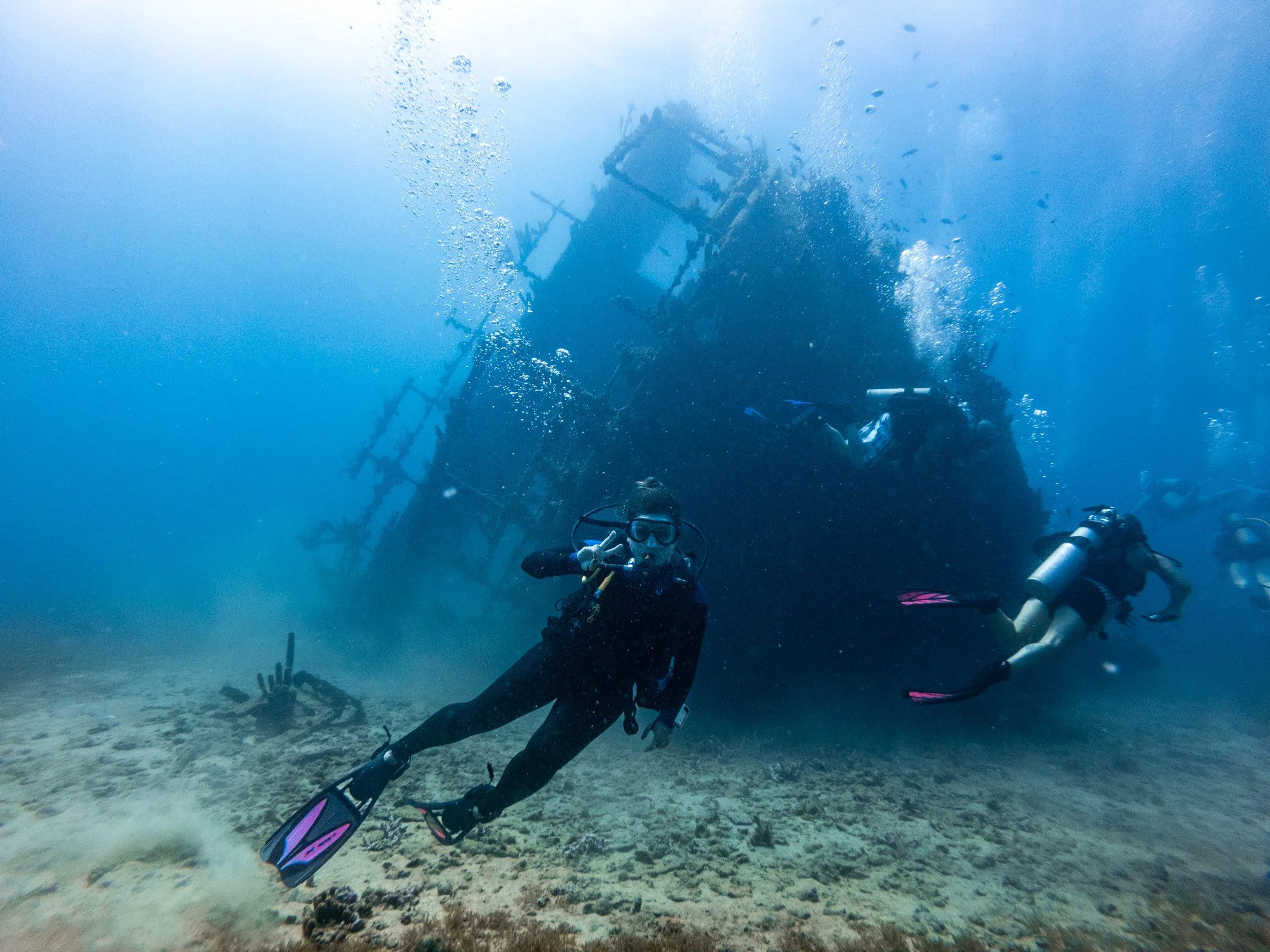 Scuba divers approaching the submerged Antilla shipwreck